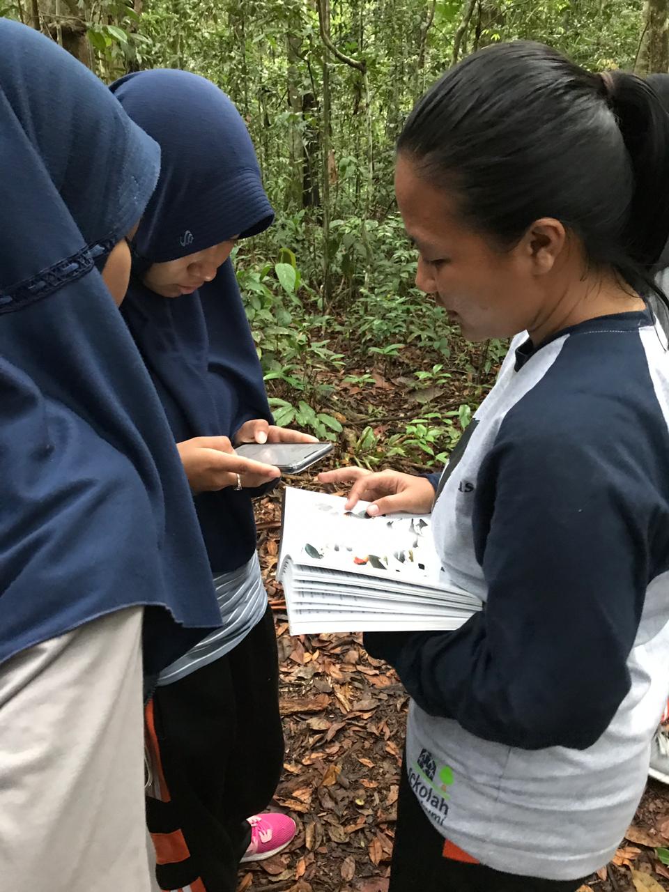 Local high school students using traditional and new ways to identify species.