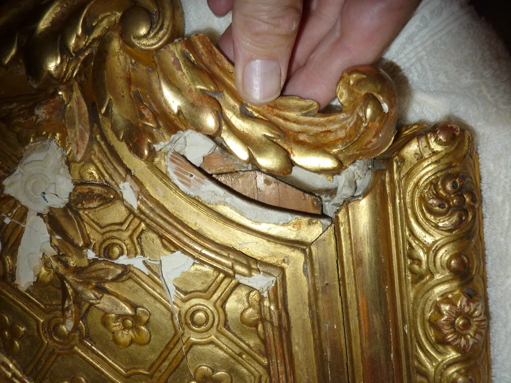 Evaluating the extent of damage to the frame after removing it from the shipping crate