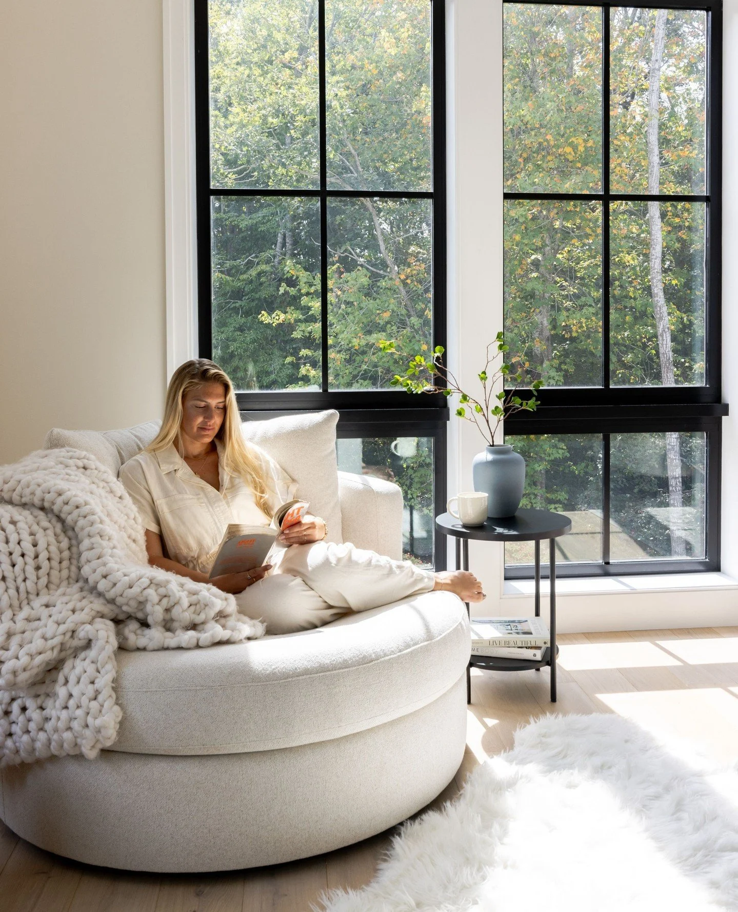 This dreamy primary bedroom reading nook is the perfect private escape&mdash;ideal for morning pages, a favorite book, or simply soaking in the quiet moments. Featuring the oversized Balboa Grand Swivel Armchair from @potterybarn and topped with a ch