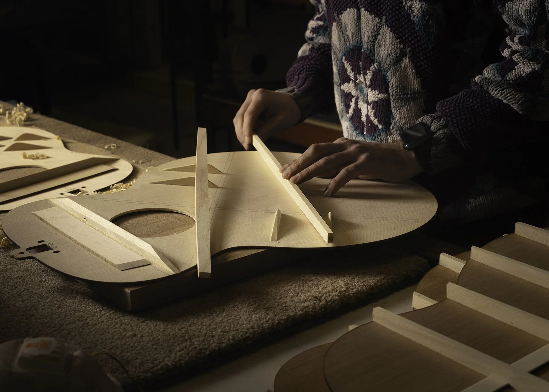 A spruce top being braced for an Iris acoustic guitar