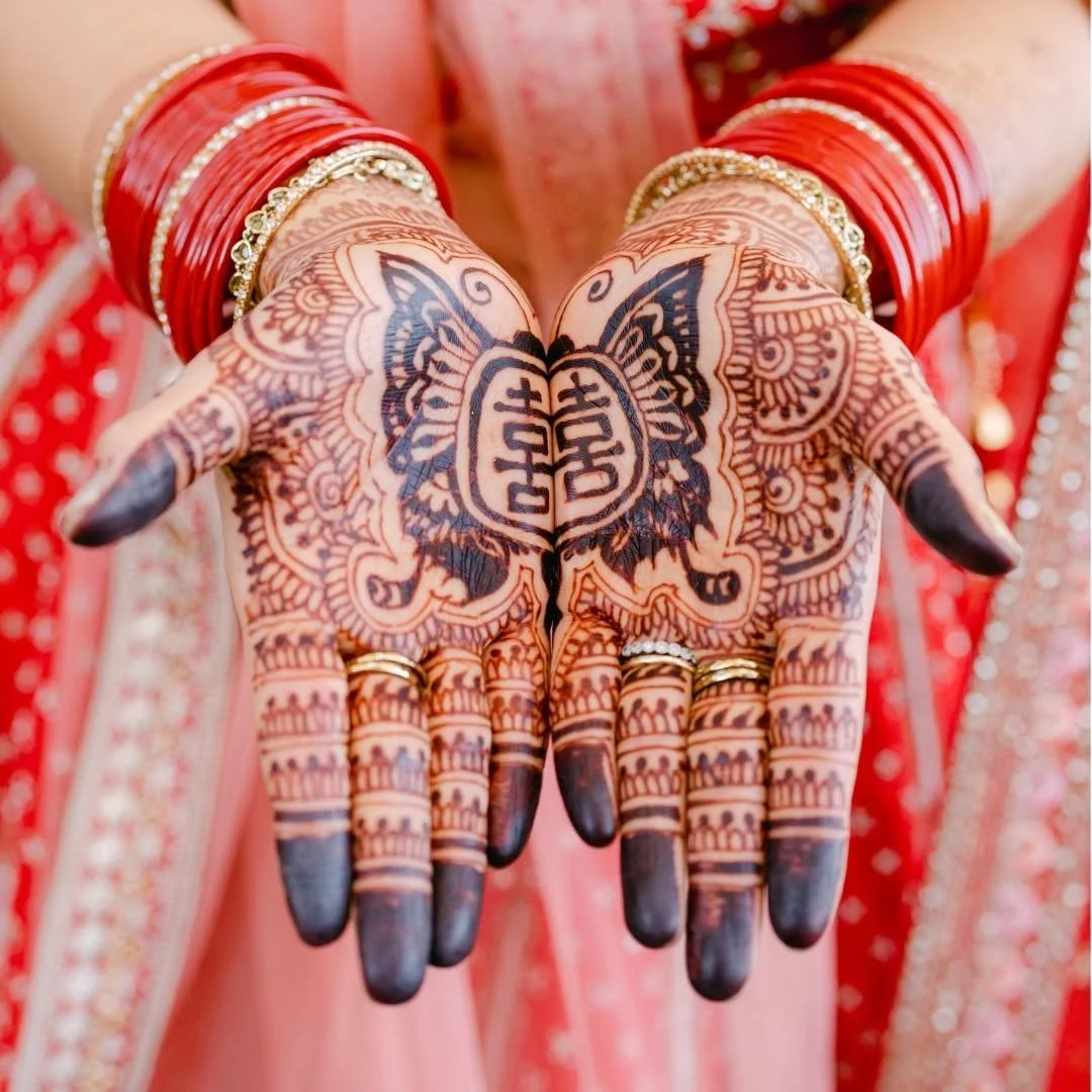 This tiny Chinese character carries a big meaning: double happiness for love, marriage, and all the good stuff that follows. 

And this is what it looks like when Chinese and Indian cultures come together: not one replacing the other, but both standi