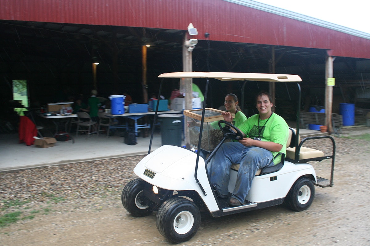 volunteers-golf-cart-art-science-woods-min.jpg