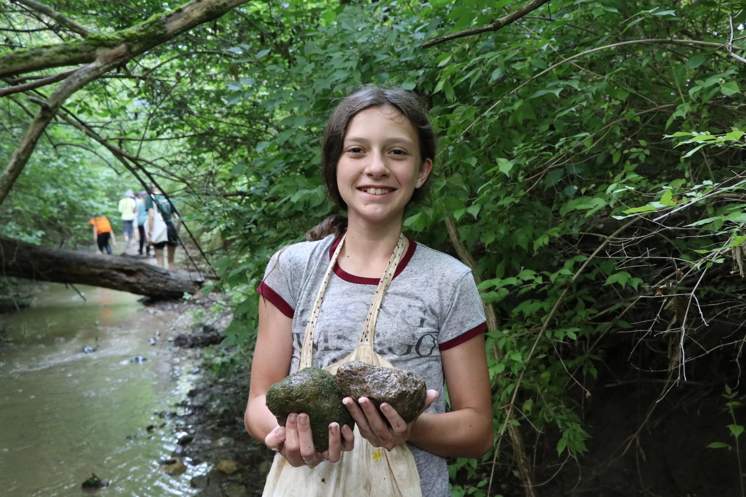 Student with rocks.JPG