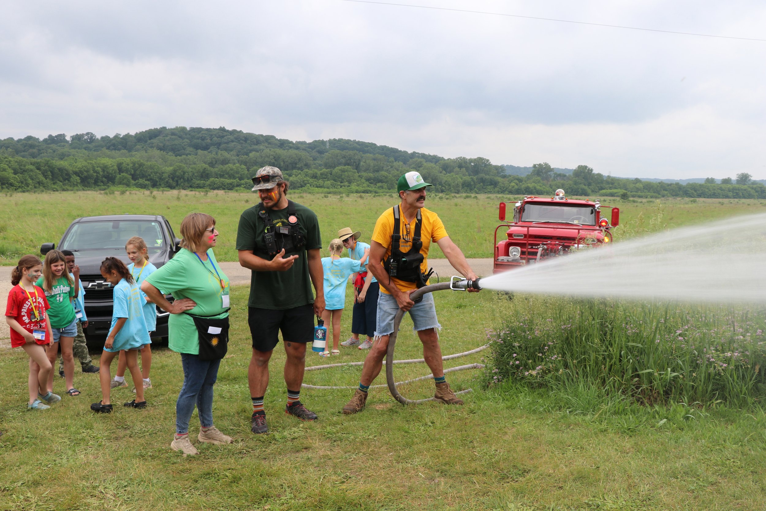 Fire hose cool down Jones boys .jpg