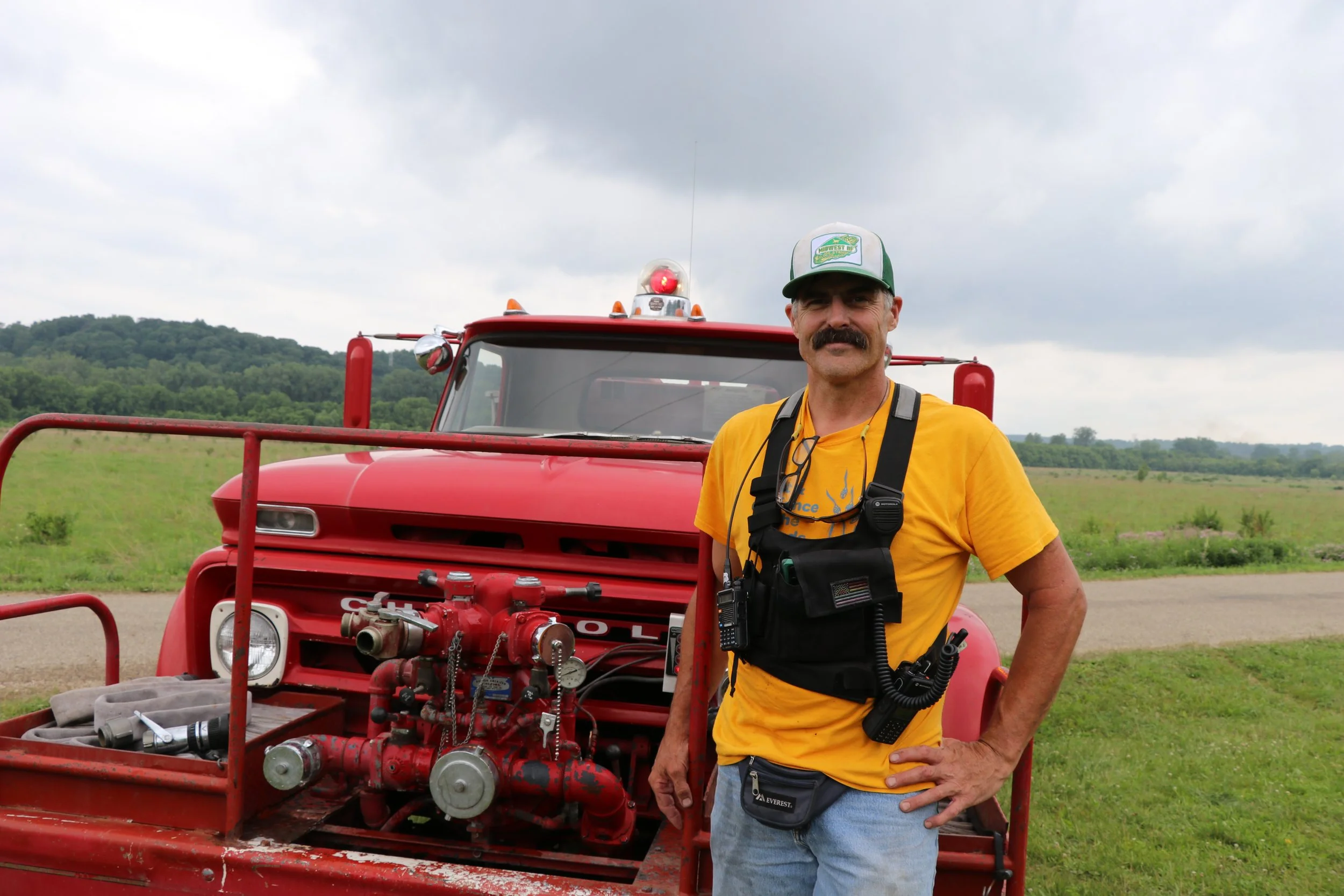 Staff Eric w firetruck .JPG