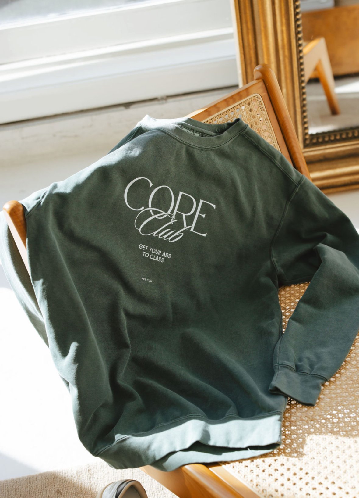 Core Club sweatshirt on chair.jpeg