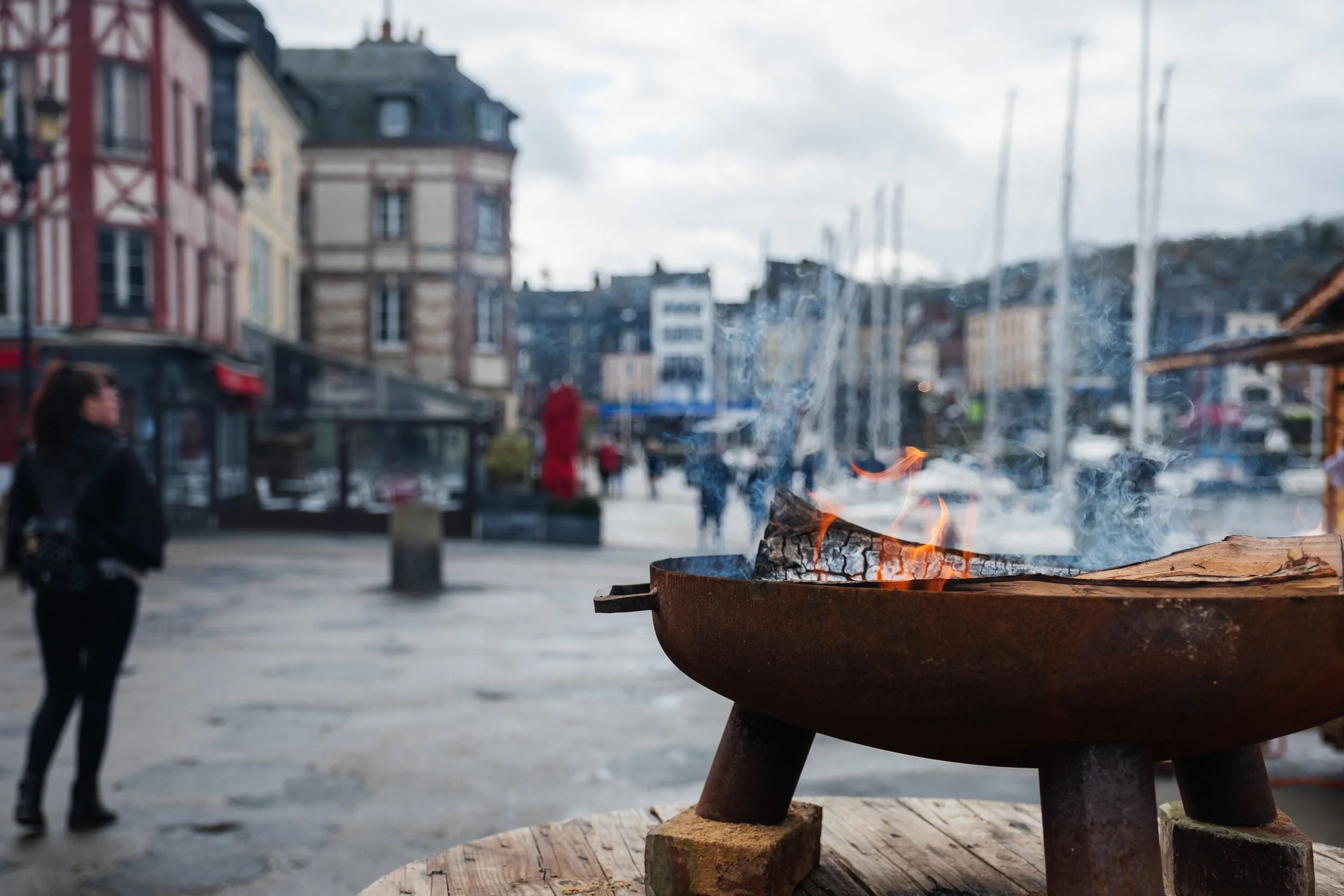 Cozy fire at the docks of Honfleur, France.