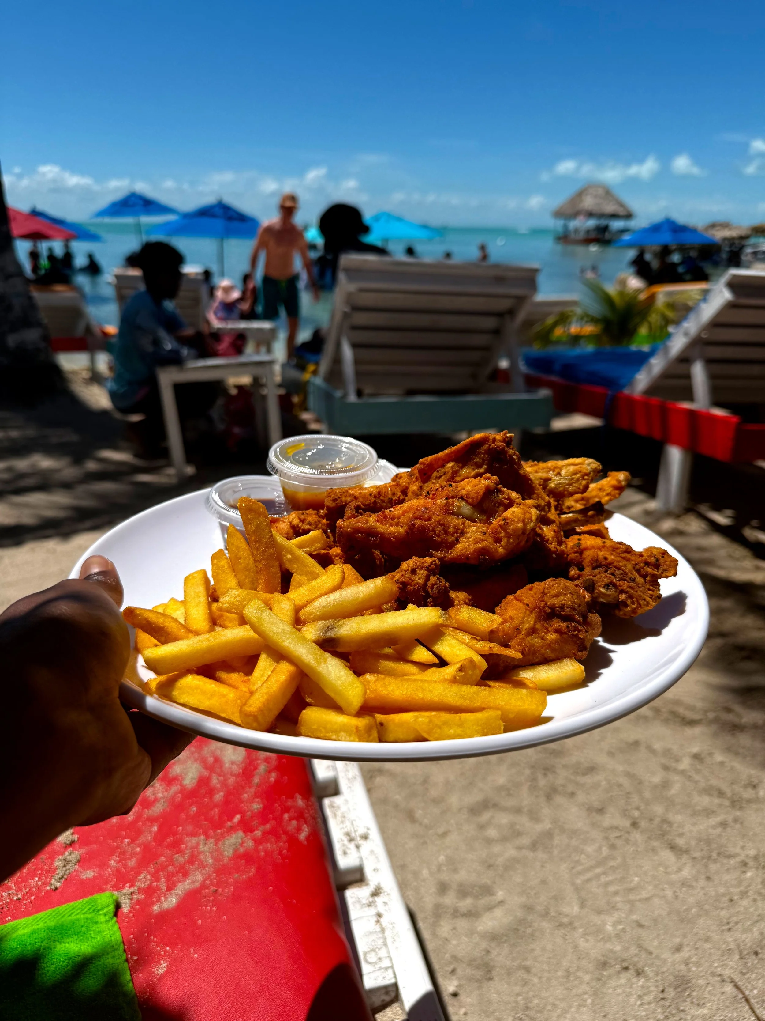 Picture of fries and wings at Happy Island Beach Bar and Grill, San Pedro, Belize