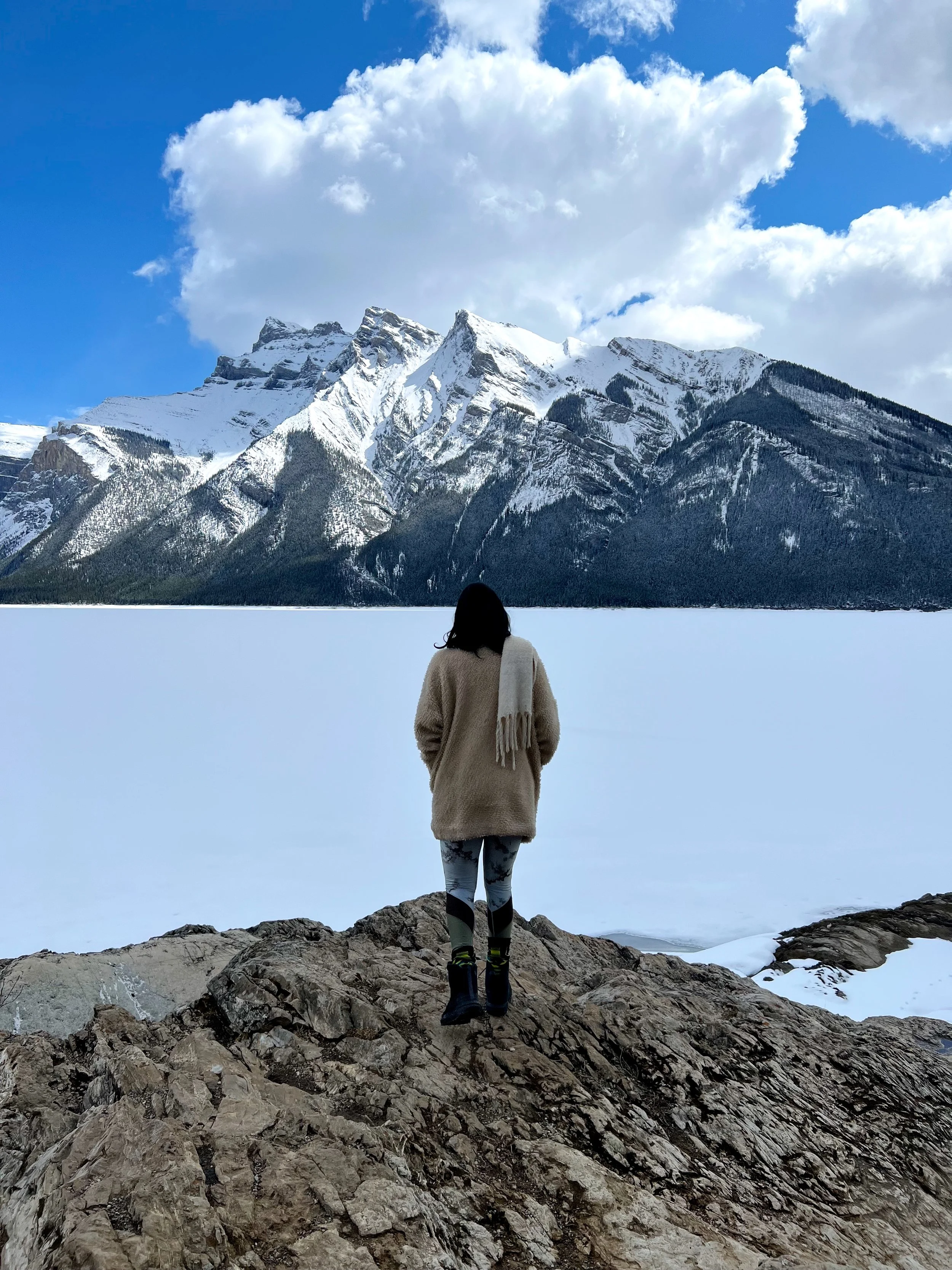 A photograph of Kris at overlooking Lake Minnewanka in Banff National Park in Alberta Canada