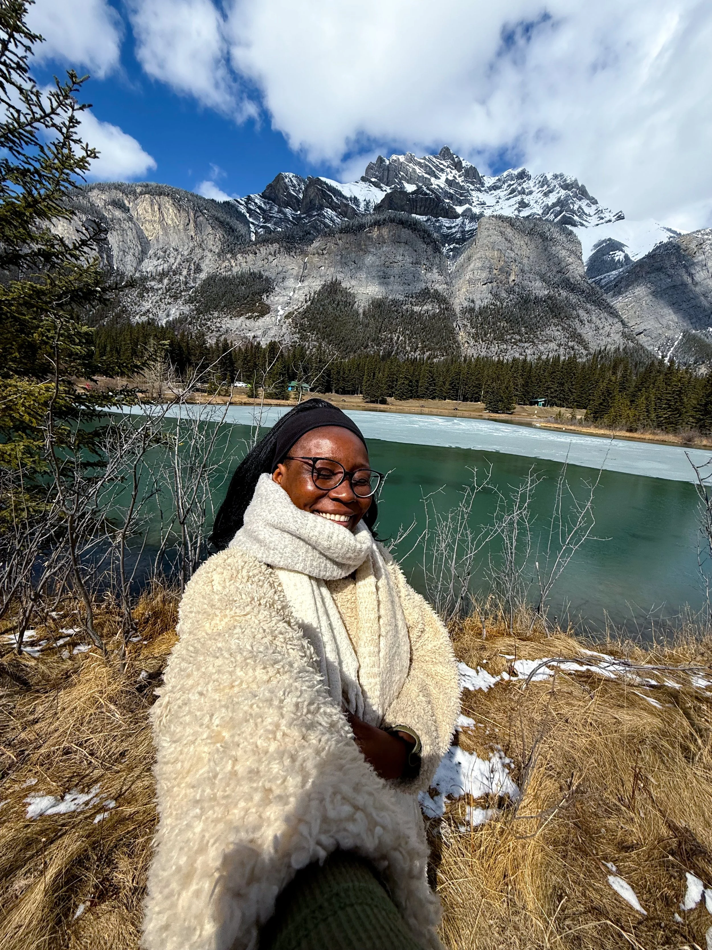 A photograph of Kris at the Cascade River in Banff National Park in Alberta Canada