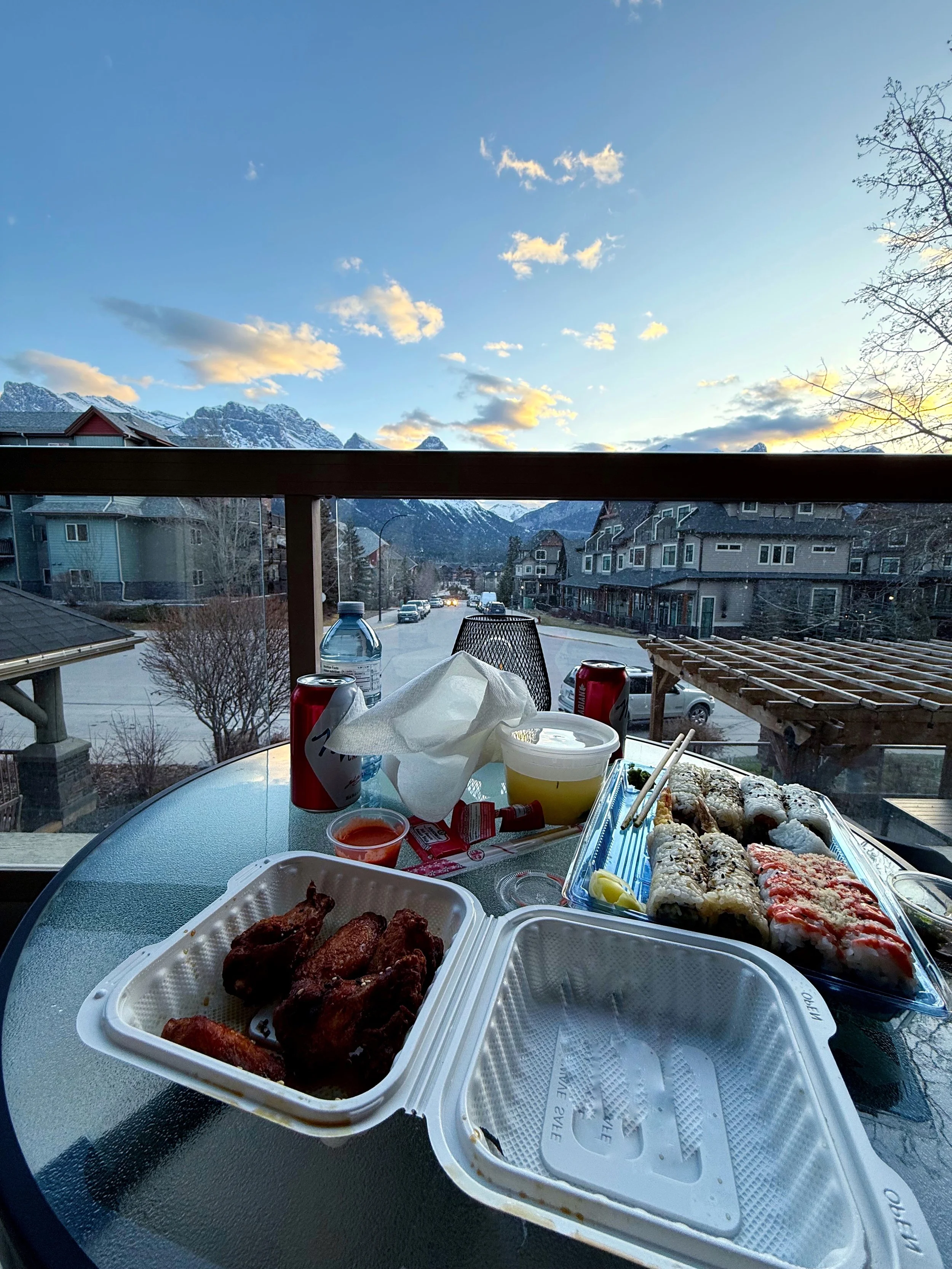A photo of sushi from Totoro Sushi in Canmore with a view of Three Sisters.