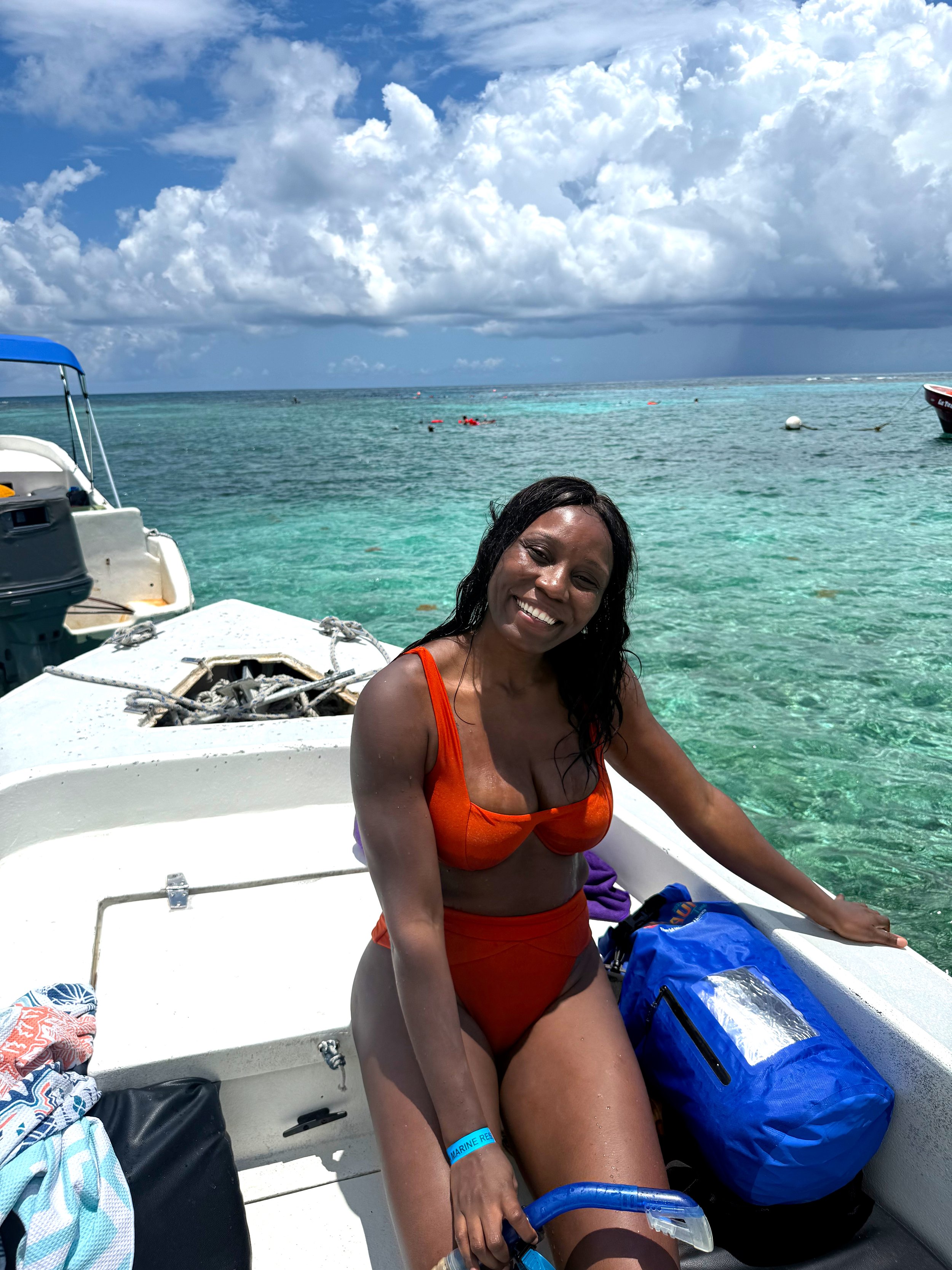 Christane on a boat in Caye Caulker on a 7-Stop Snorkeling Tour