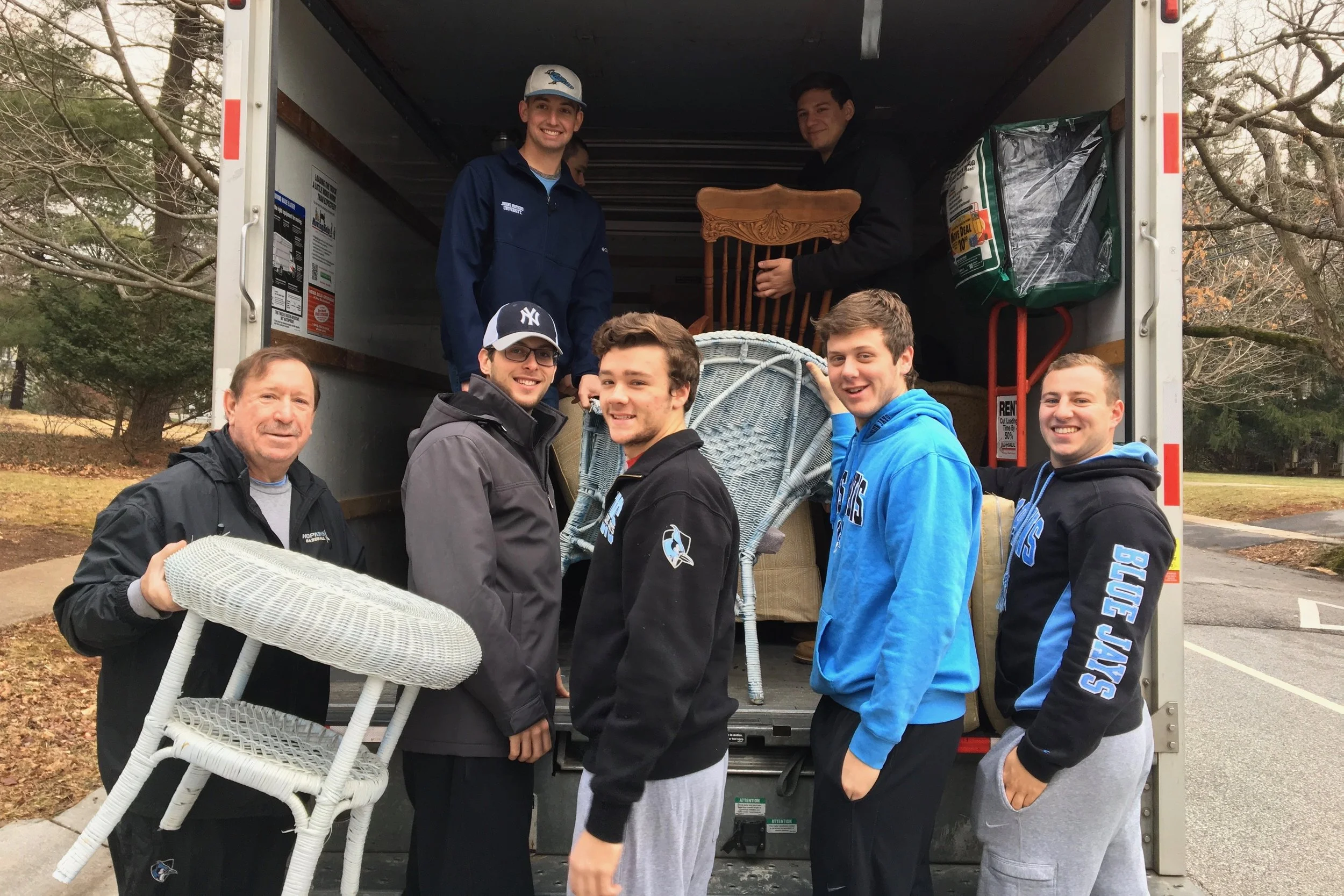 Baseball players volunteer in their Baltimore community.