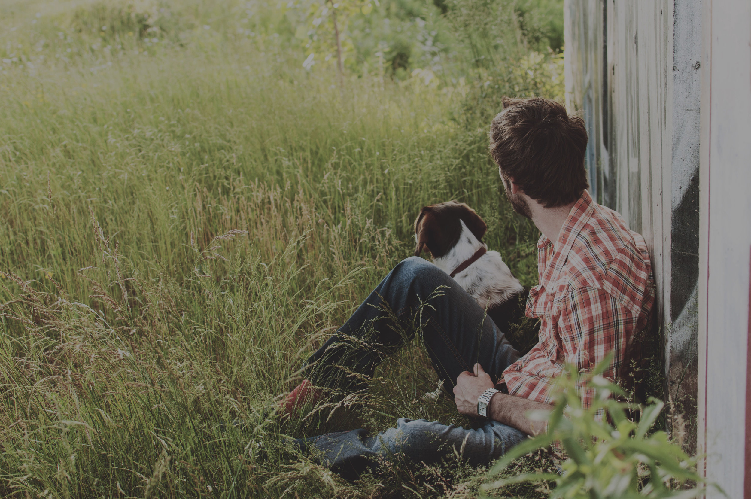 dog-and-man-by-barn.jpg