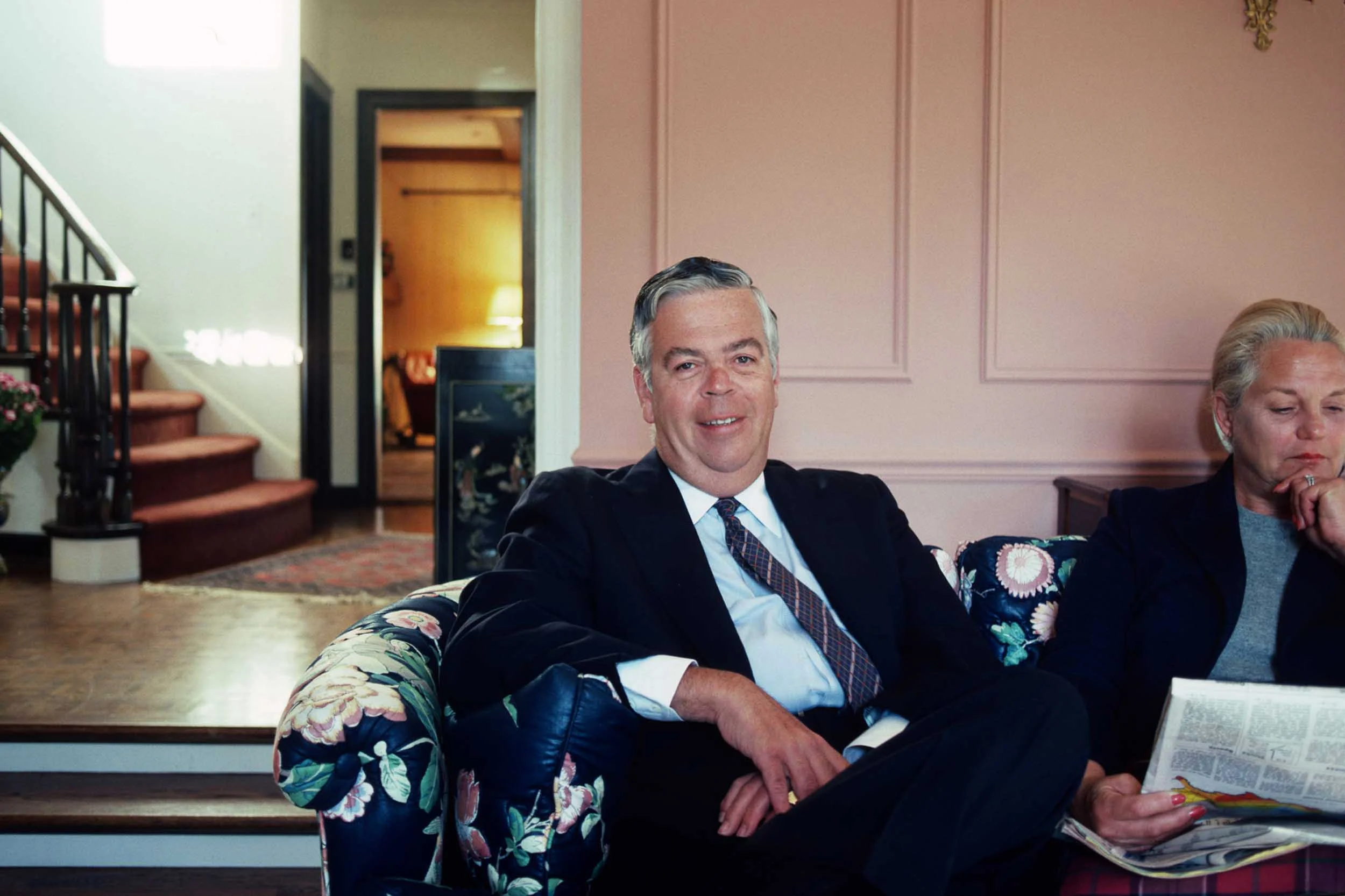 Bally Chairman Robert Mullane sitting with his wife in Chicago, for Fortune . 1984