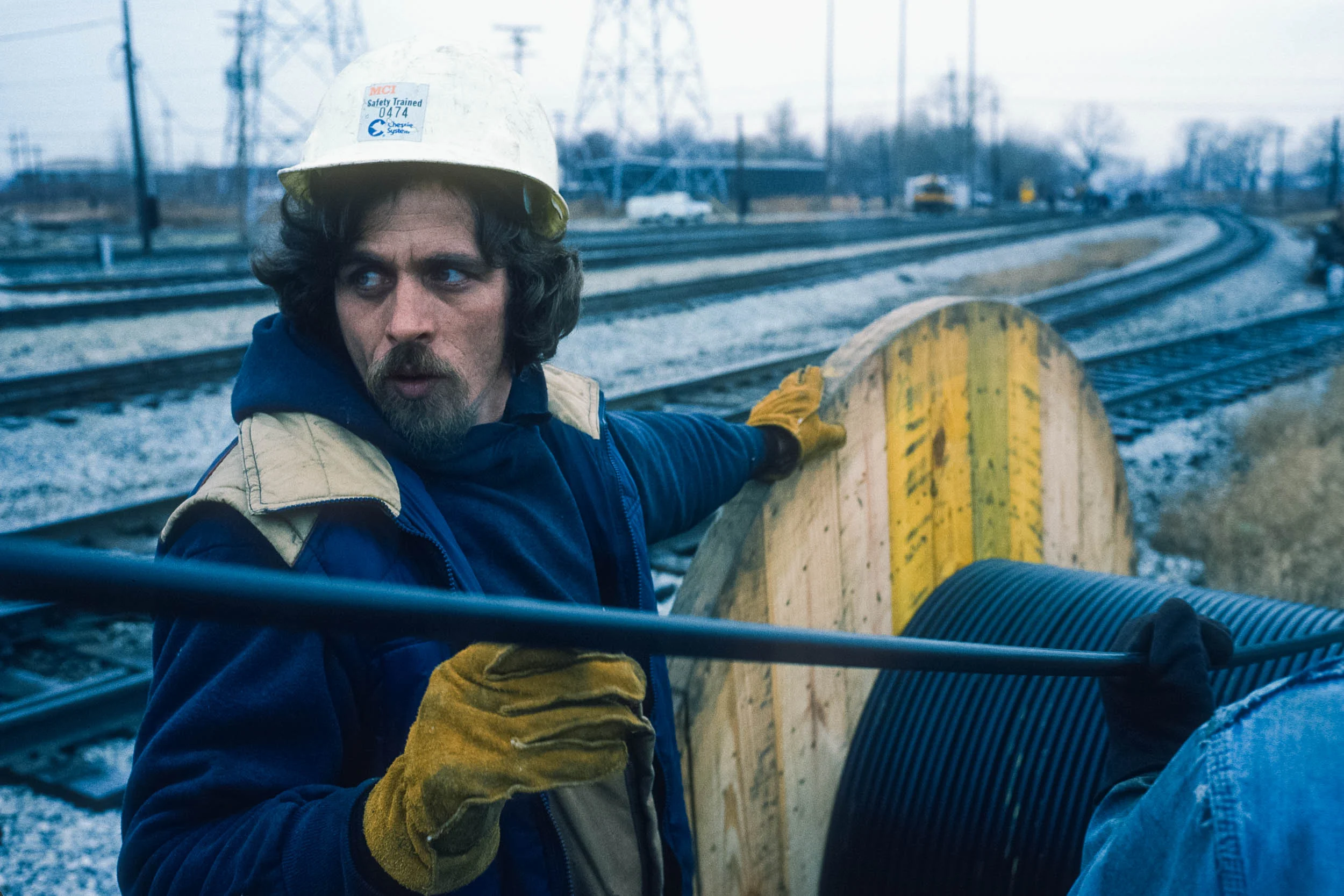 Laying fiber optic cables along railroad right-of-ways, for the MCI Annual Report . 1984