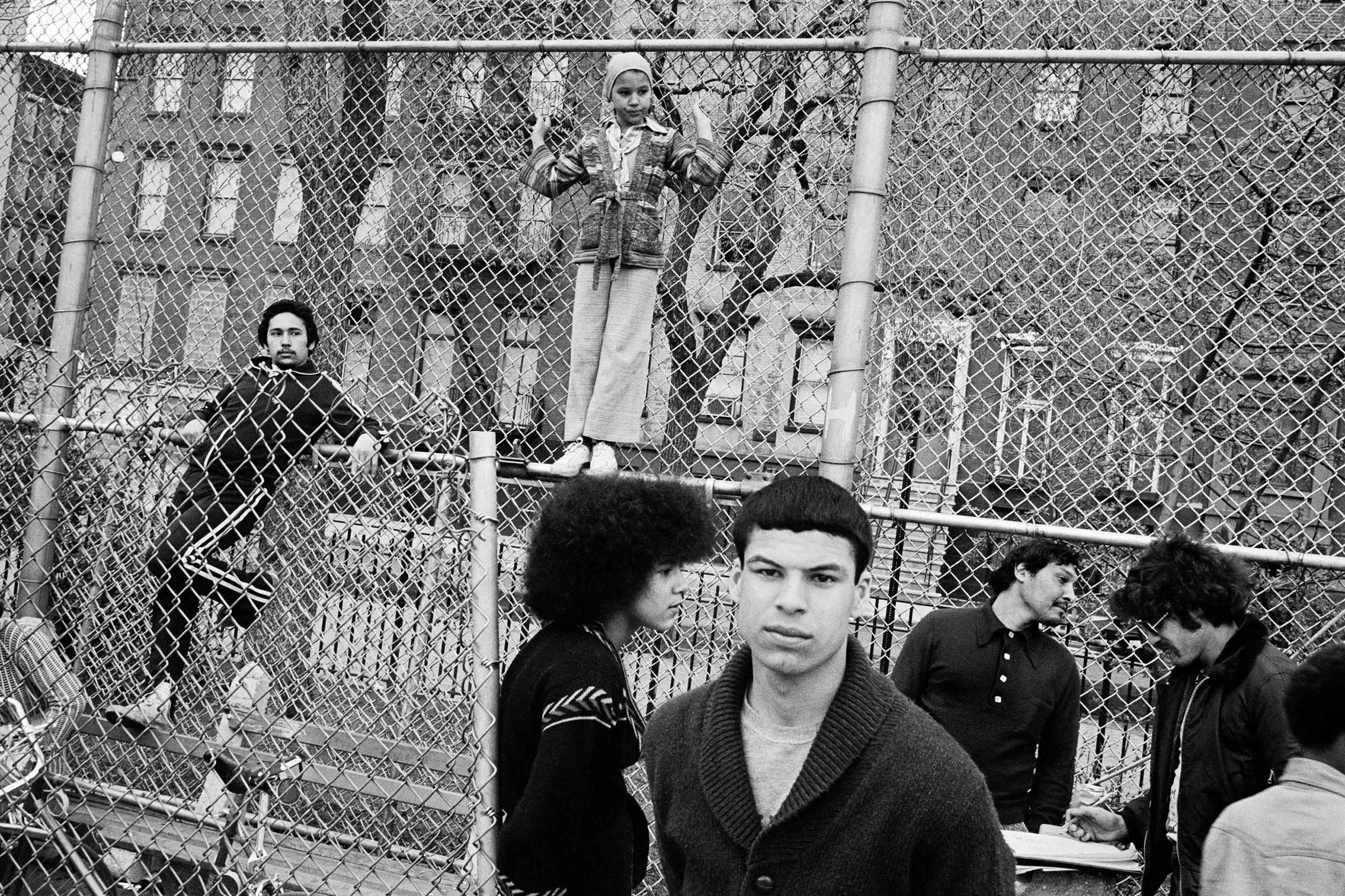 Next to the baseball diamond at the corner of Tenth Street and Avenue A in Tompkins Square Park. From Alphabet City . 1977