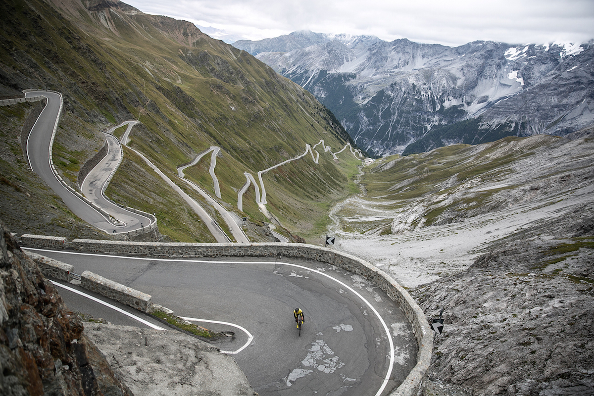 Mike Climbing The Stelvio Pass, a mountain pass in northern Italy, elevation of 9,045 ft. It is the highest paved mountain pass in the Eastern Alps, and the second highest in the Alps, just 43 ft below France's Col de l'Iseran (9,088 ft).