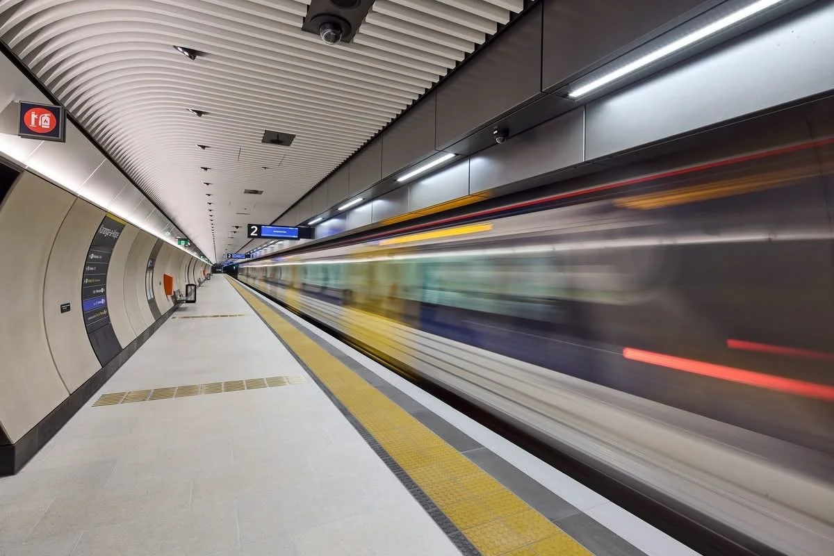 White terrazzo tiles, gray and yellow tactiles at train stations Auckland