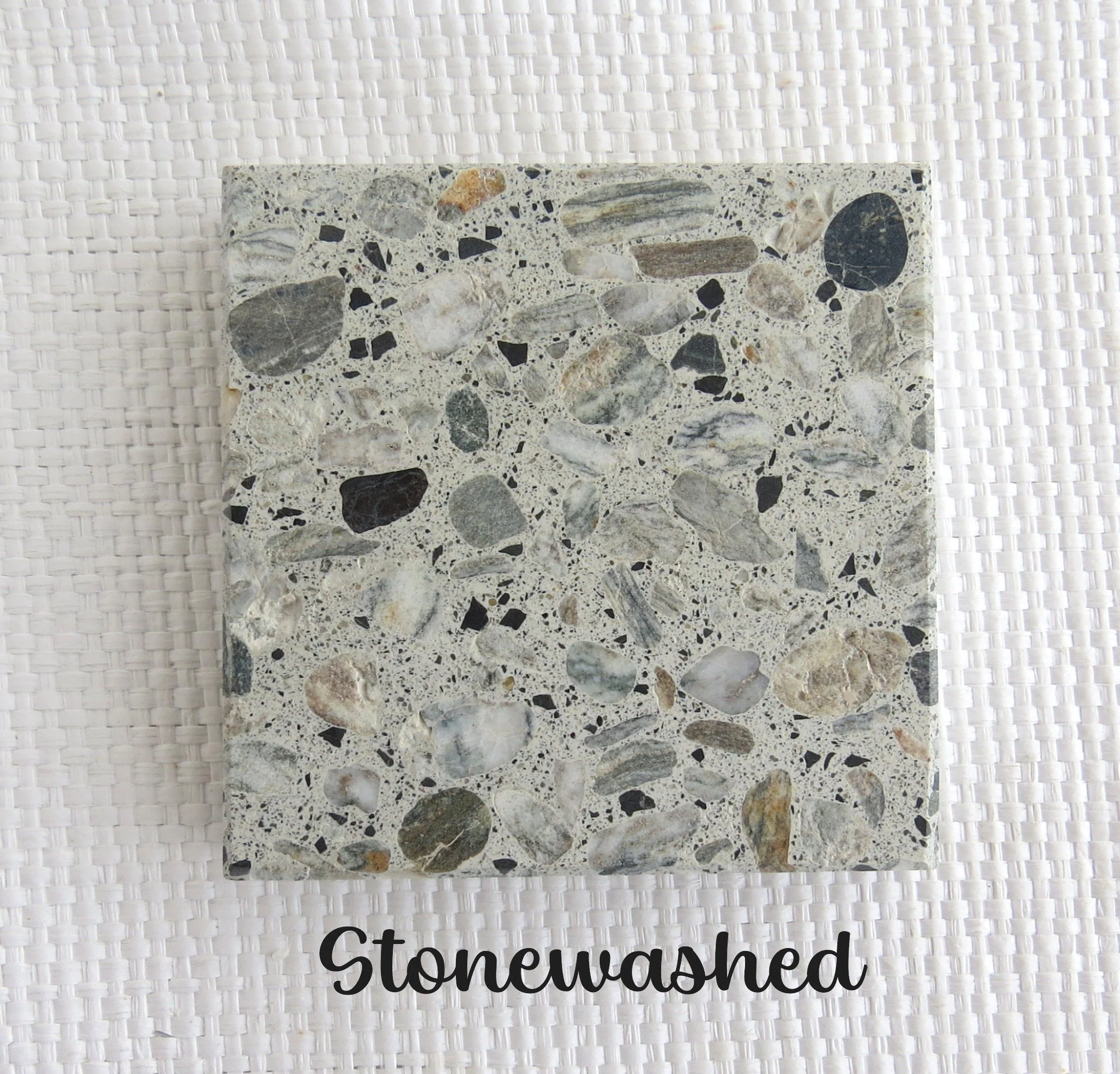 STONEWASHED tile- A light blue gray like the faded denim we wear when hiking in the bush and walking along the river banks. NZ schist pebble in a white/ light gray hued base