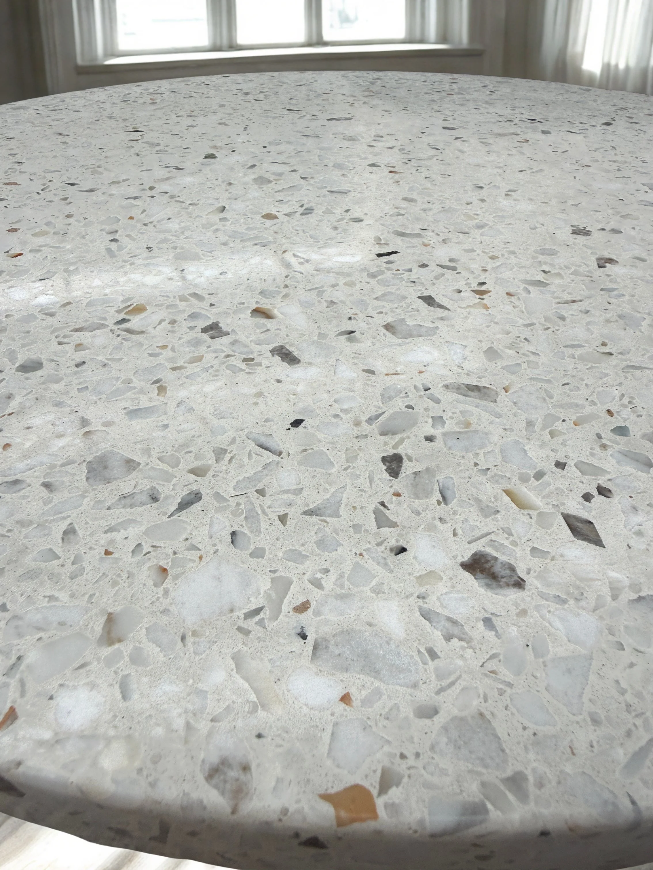 Feathered 700mm terrazzo table top close up side view.jpg