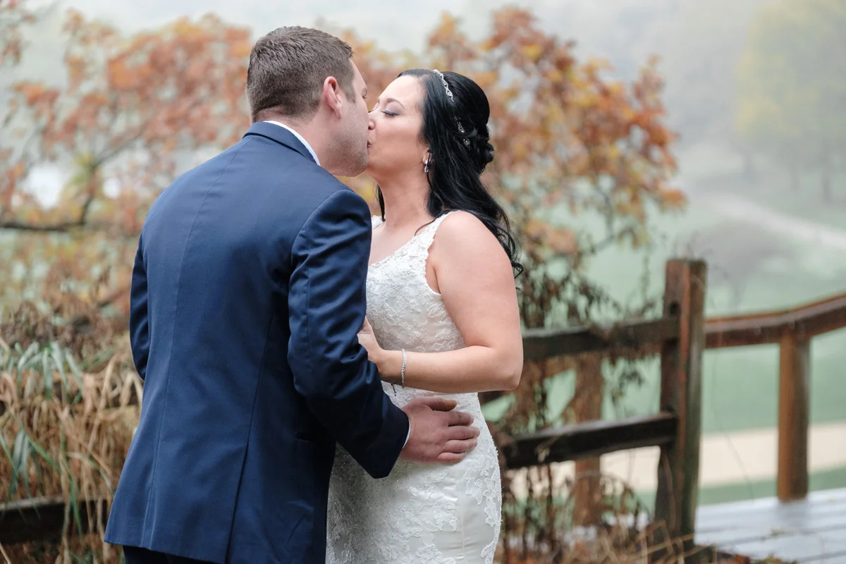 bride and groom kissing during first look at grand geneva resort in lake geneva wisconsin
