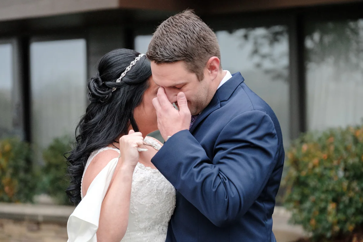 groom crying during first look at lake geneva resort wedding