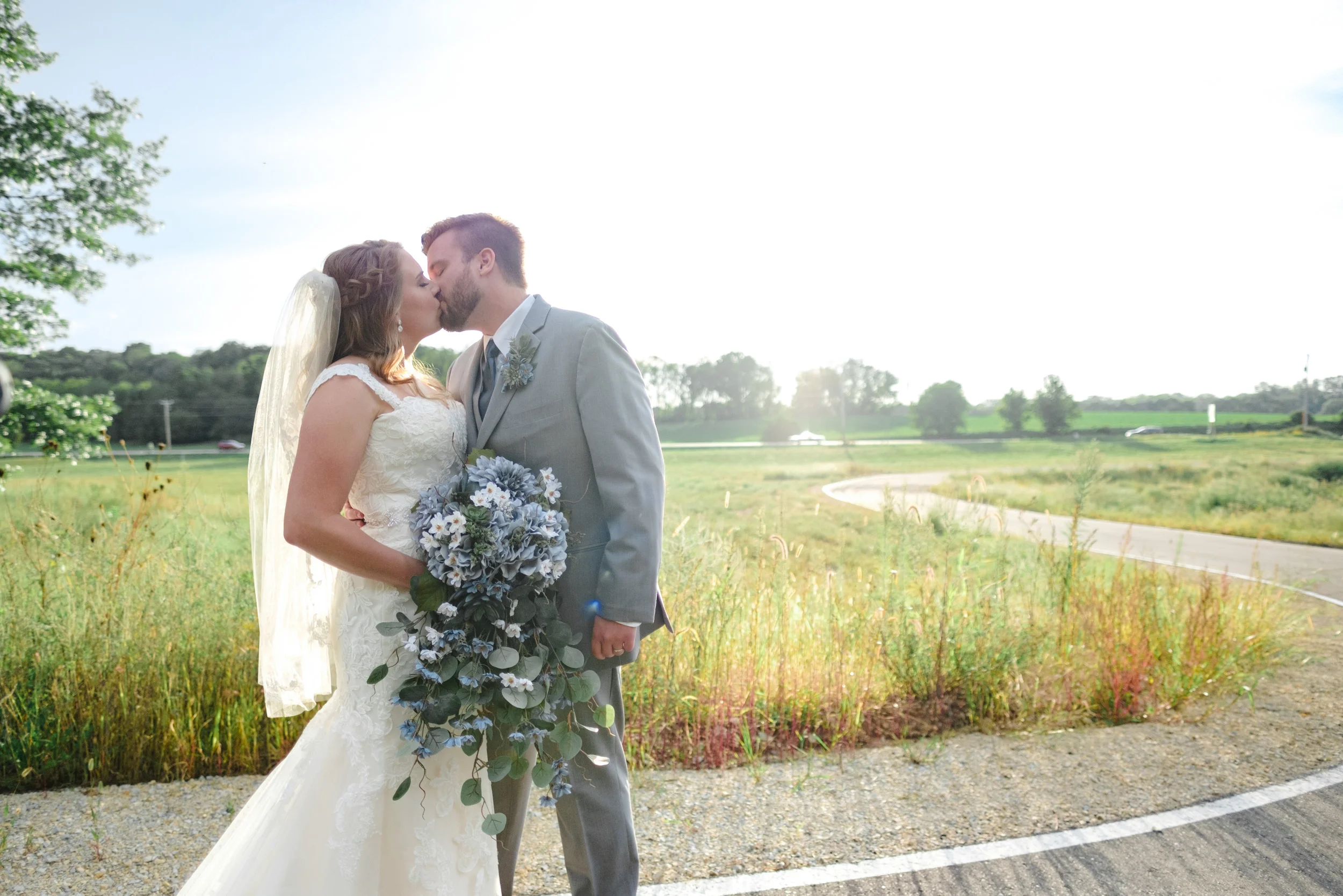 Bride and Groom kiss at The Fields Reserve in Stoughton, Wisconsin after their wedding ceremony