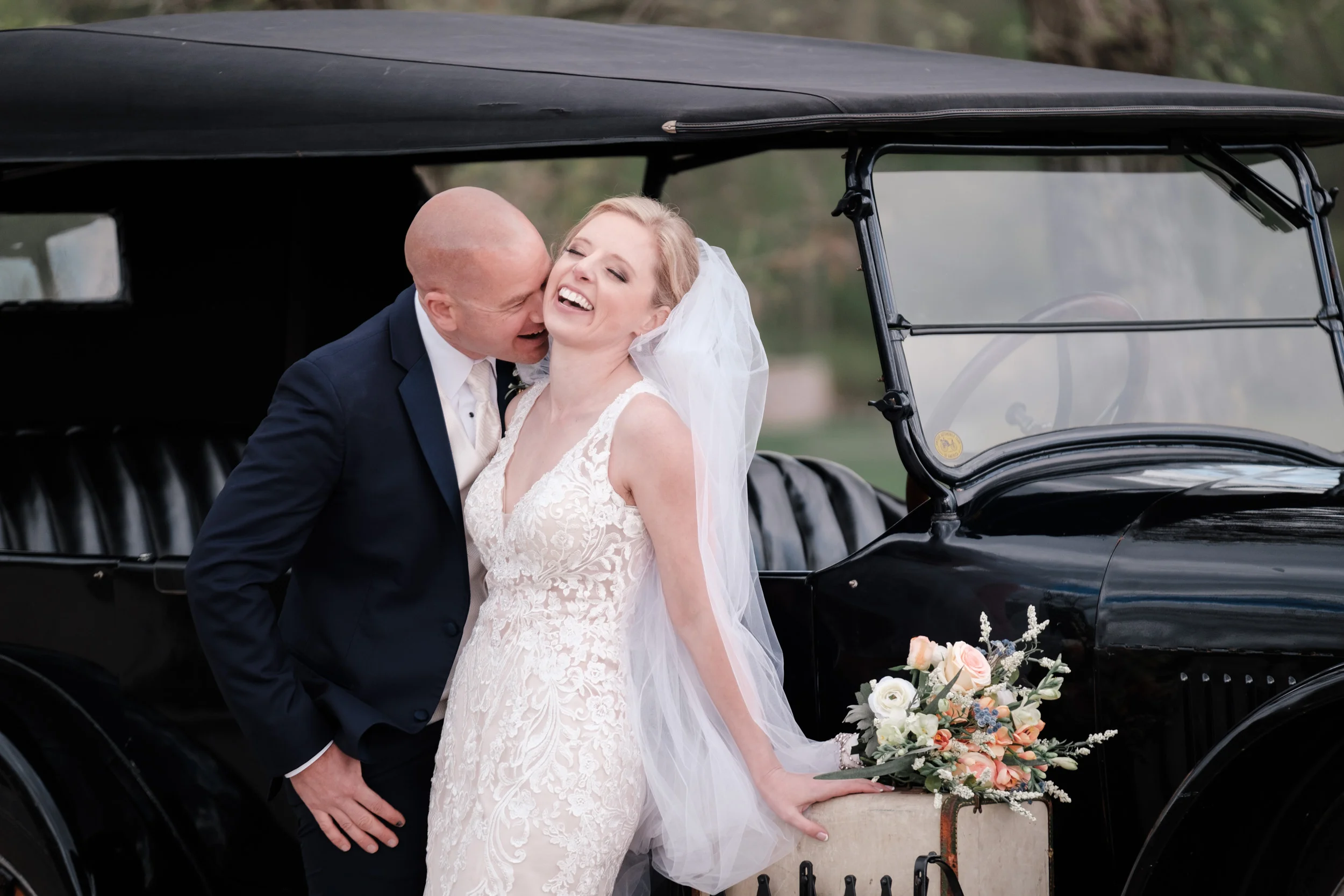 natural portrait of bride and groom laughing on wedding day at the brix