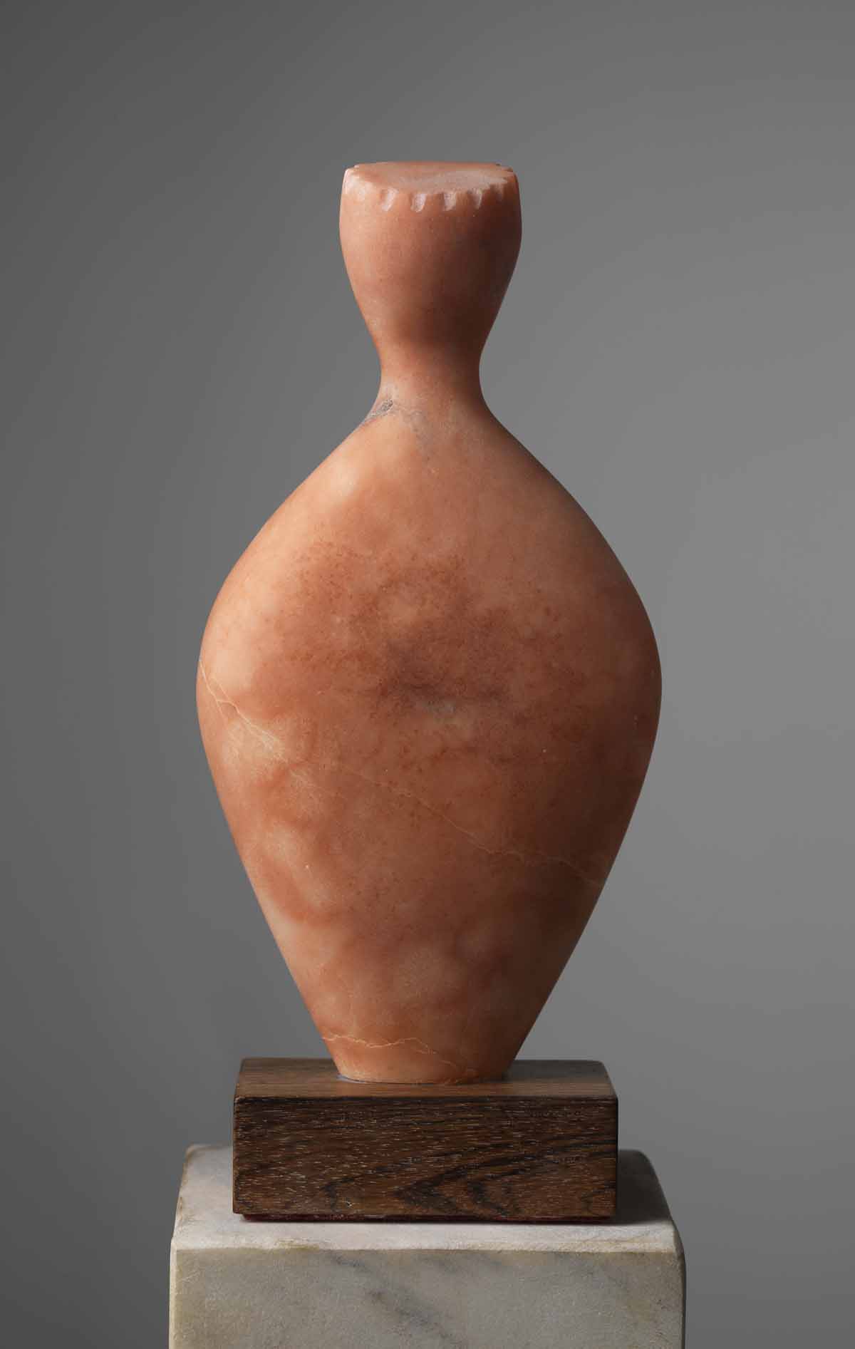   Untitled Head and Torso 1 (Abstract),&nbsp; Red alabaster on a wood plinth, 11" x 5.5" x 2.5" 