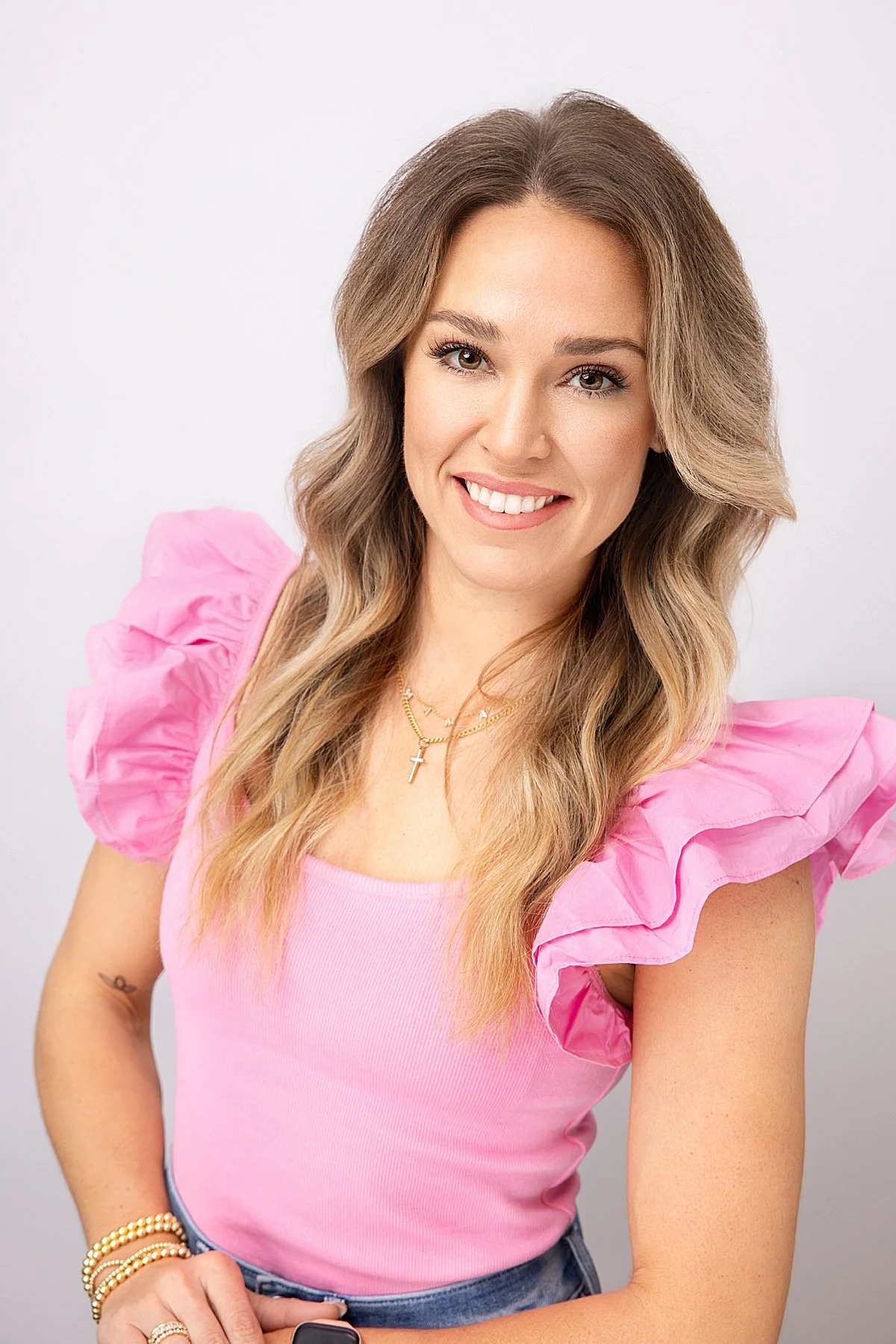 smiling-personal-branding-headshot-pink-ruffle-shirt.jpg
