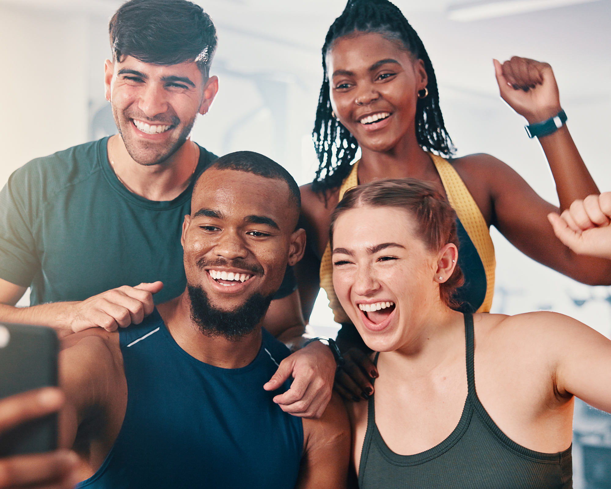 young men and women smiling for a photo