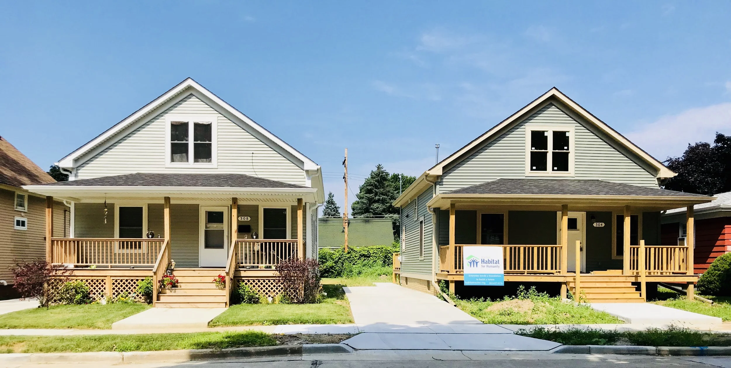 Two of our Habitat houses on Wickham Boulevard. The house on the left is finished, while the one on the right is nearly complete.