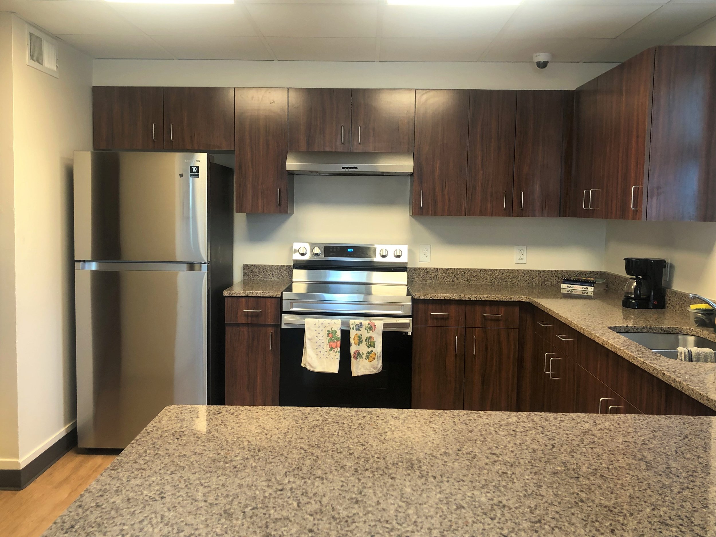 Families share refrigerators and have separate cabinets to store dry good.