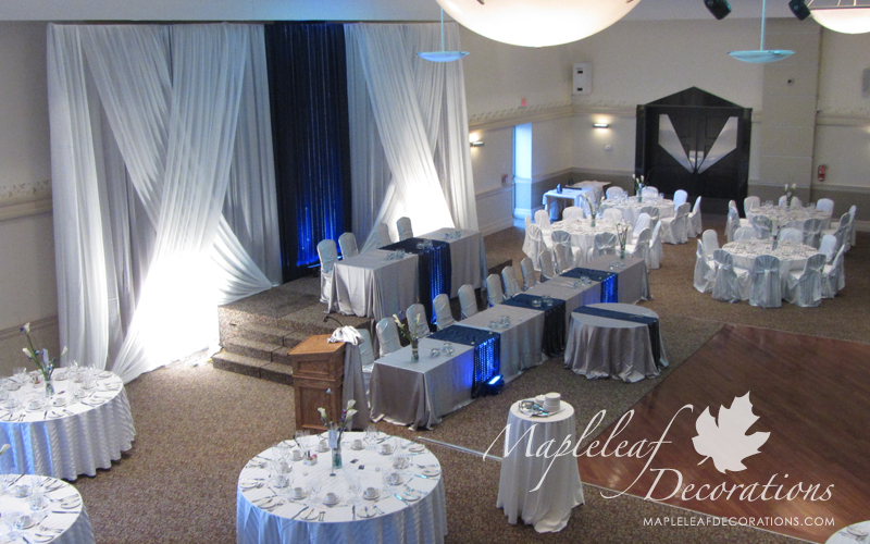 toronto-wedding-decorations-modern-backdrop-head-table-two-tiere-blue-navy-silver-satin-chair-covers-table-linens-overlays-runners-rental-grand-baccus-banquet-hall-scarborough-maple-leaf-decorators-crystals.jpg