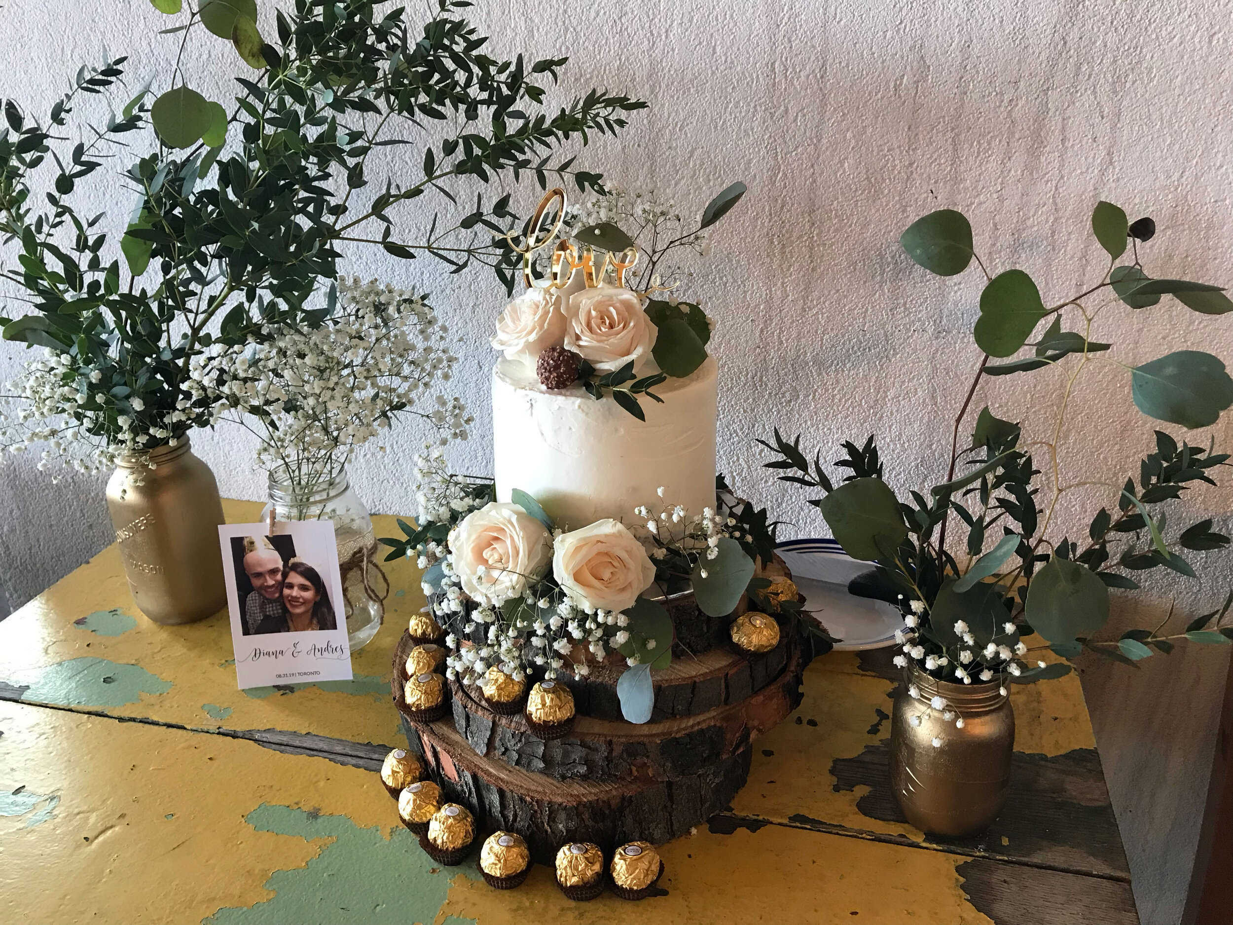 diana-andres-rustic-harvest-cake-table-naked-cake-eucalyptus-wooden-discs-ferrero-rocher-cake-topper-love-polaroid-mason-jar-centerpeices-greenery-tyscany-wedding-2.jpg
