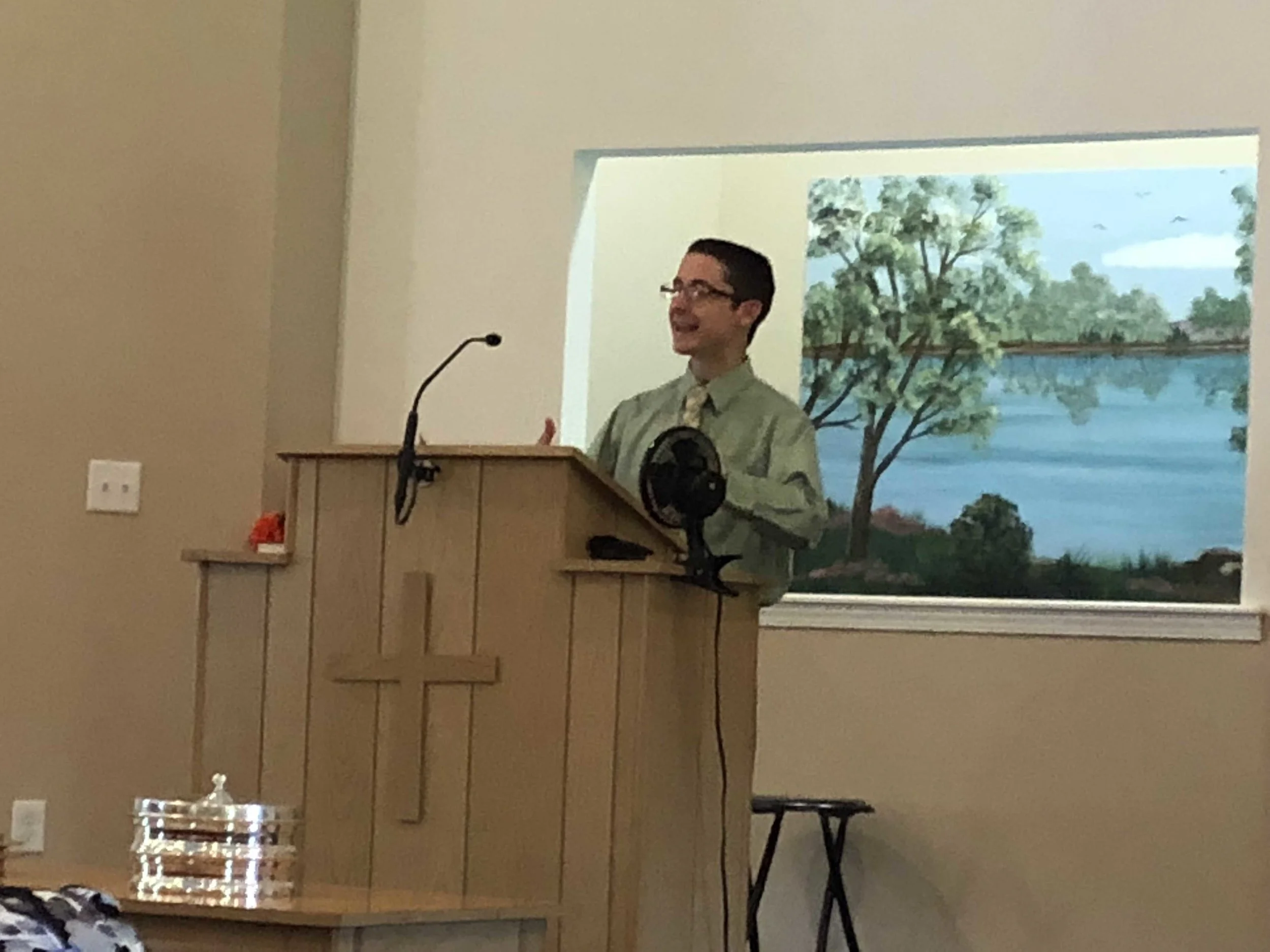 Photo of Nate Birt, author of Frozen, But Not Forgotten, speaking at a church.