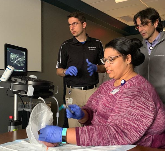 Dr. Poffel practices Ultrasound-Guided injections under the guidance of Dr. Bring while Dr. Demertzis observes