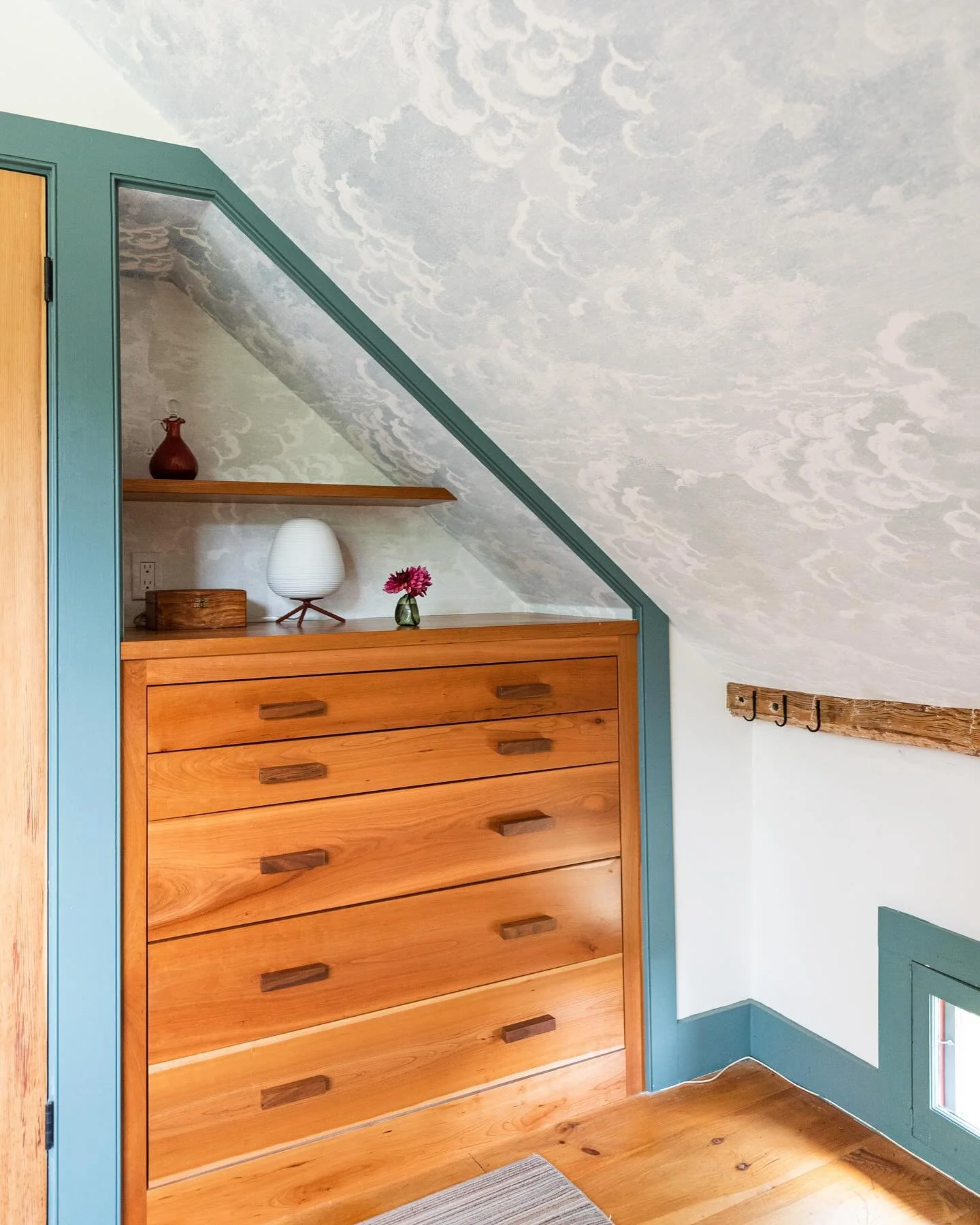 How to handle a sloped ceiling in an old house? Custom designed and built drawers, closet, storage- voila!
#undertheeaves #slopedceiling #countryhouse