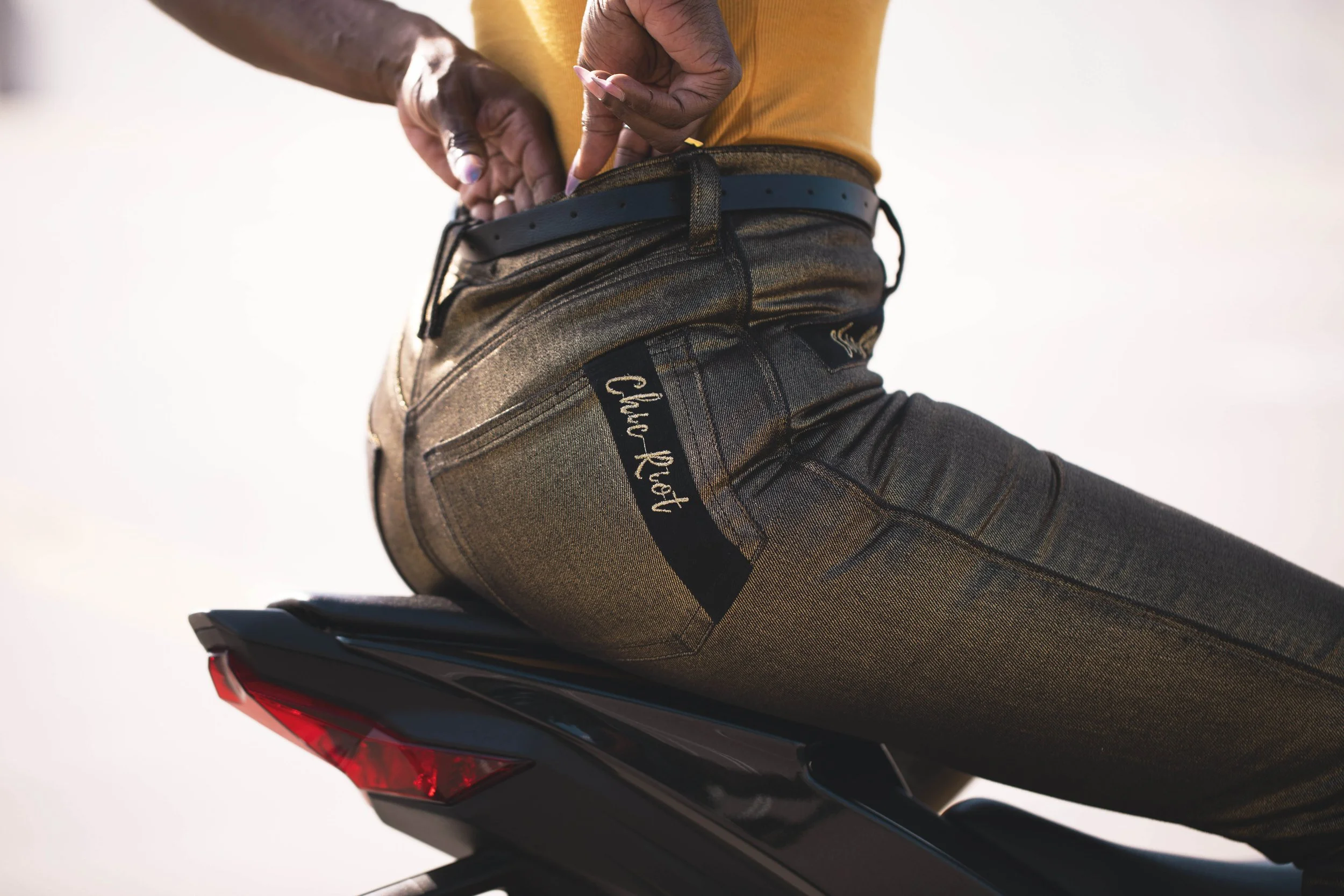 Chic-Riot-Lynn-Moto-Jeans-636-Sitting-On-Back-Of-Bike.jpg