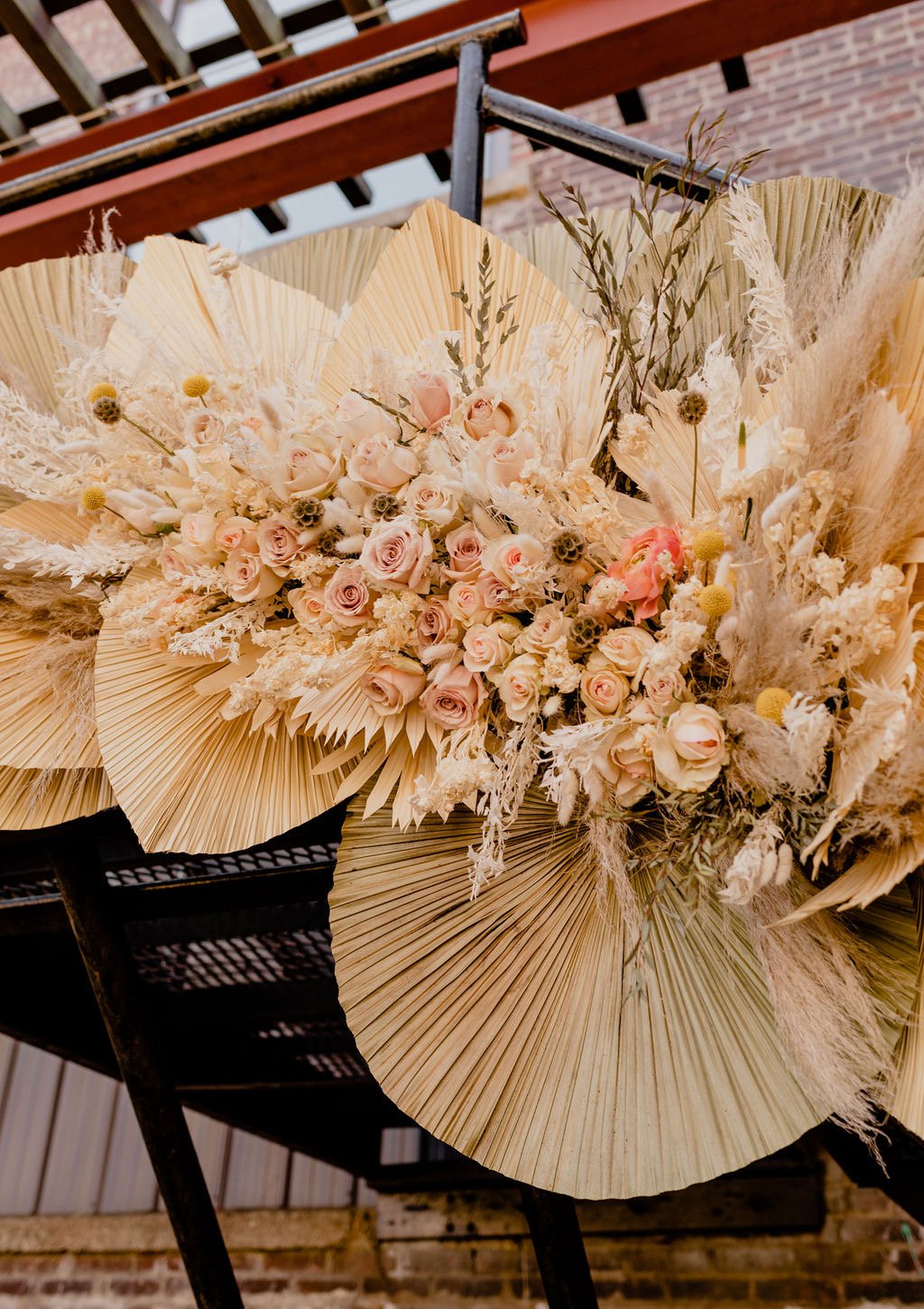 Palms and pampas grass wedding arrangement