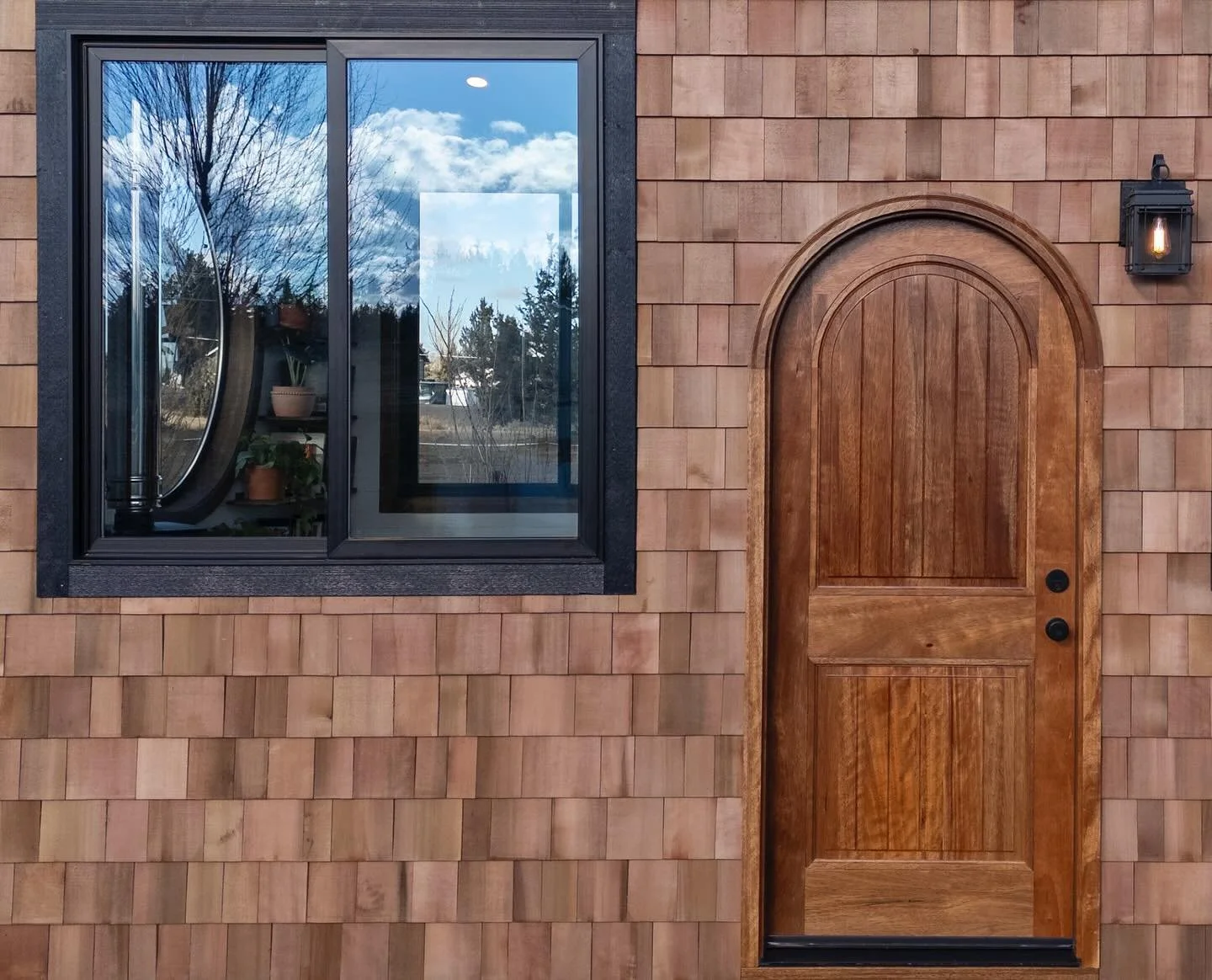 ✨ A closer look inside our newest custom tiny home &mdash; a little cottage where whimsy meets craftsmanship. From the 60&rdquo; round window and cozy wood-stove nook to the loft skylights and handcrafted bookshelves, every corner tells a story. Swip