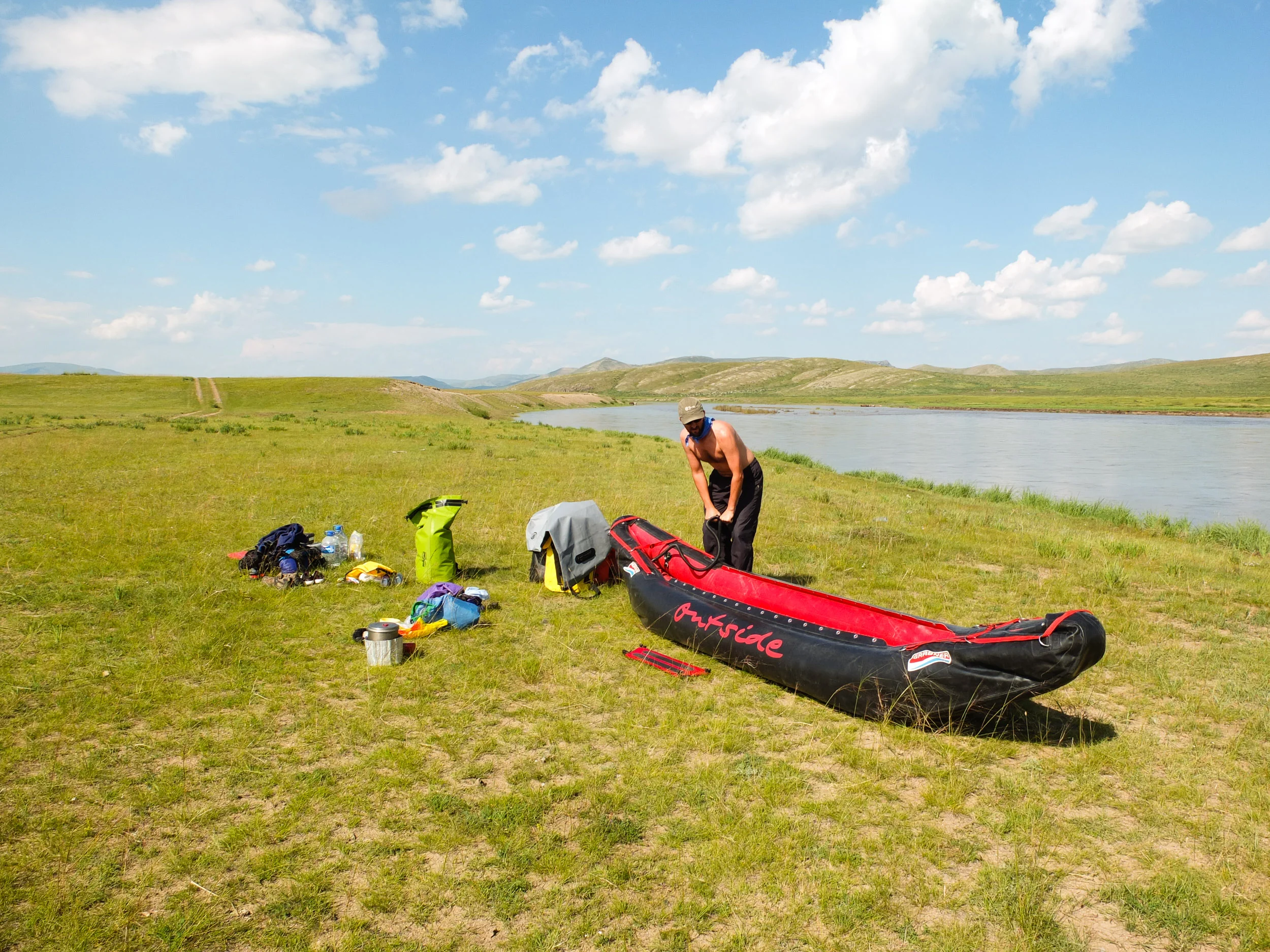 My good self, pumping up our raft at the put-in. Orkhon River, Mongolia. Photo by Jane.