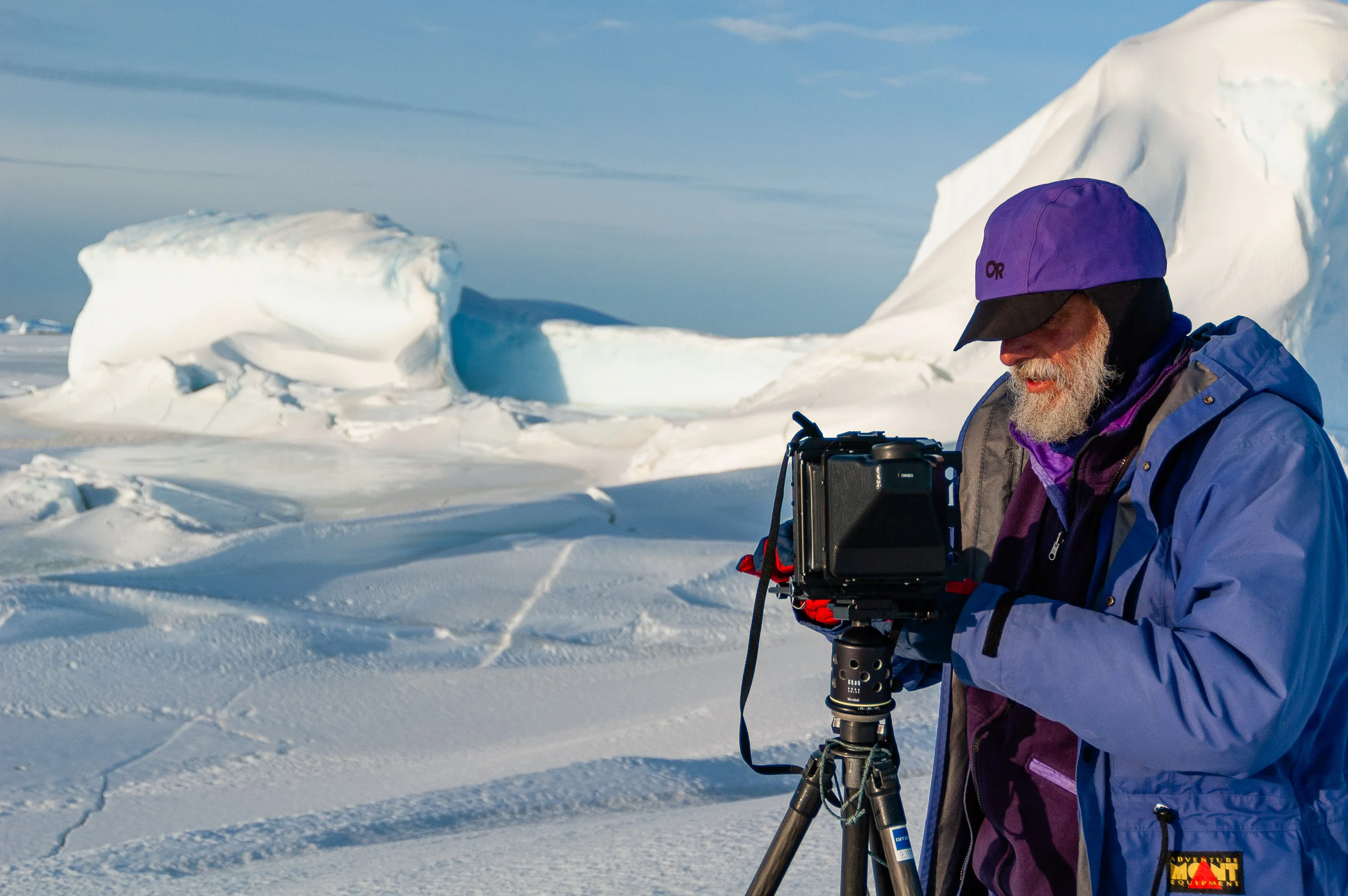 Photographer David Neilson in action, Vestfold Hills, Antarctica. © www.thomaspickard.com