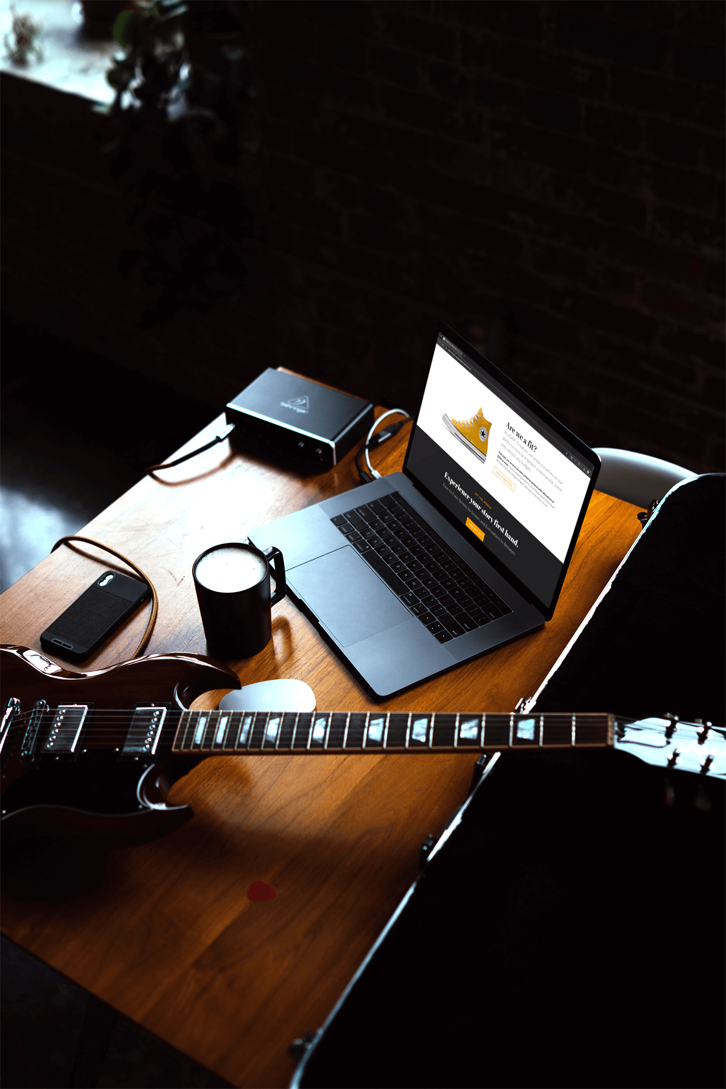 macbook-pro-mockup-placed-next-to-a-guitar-2449-el1 (1).png