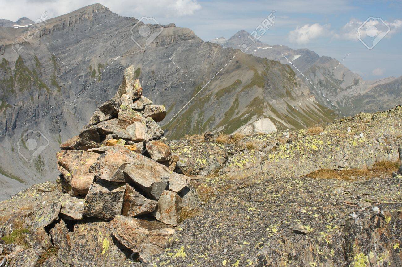 16490333-pile-of-stones-marking-way-in-french-alps.jpg