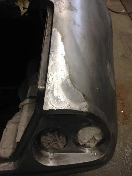 The passenger quarter panel received a coat of lead. Now we have to file finish the lead.