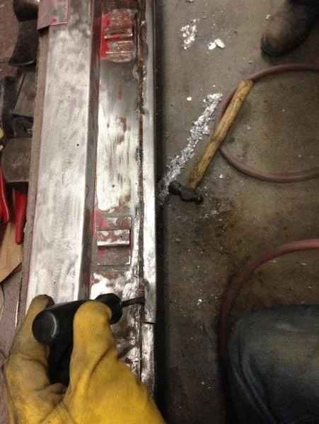 We cut the rocker from inside the door jamb to move out to sit flush with bottom edge of door.