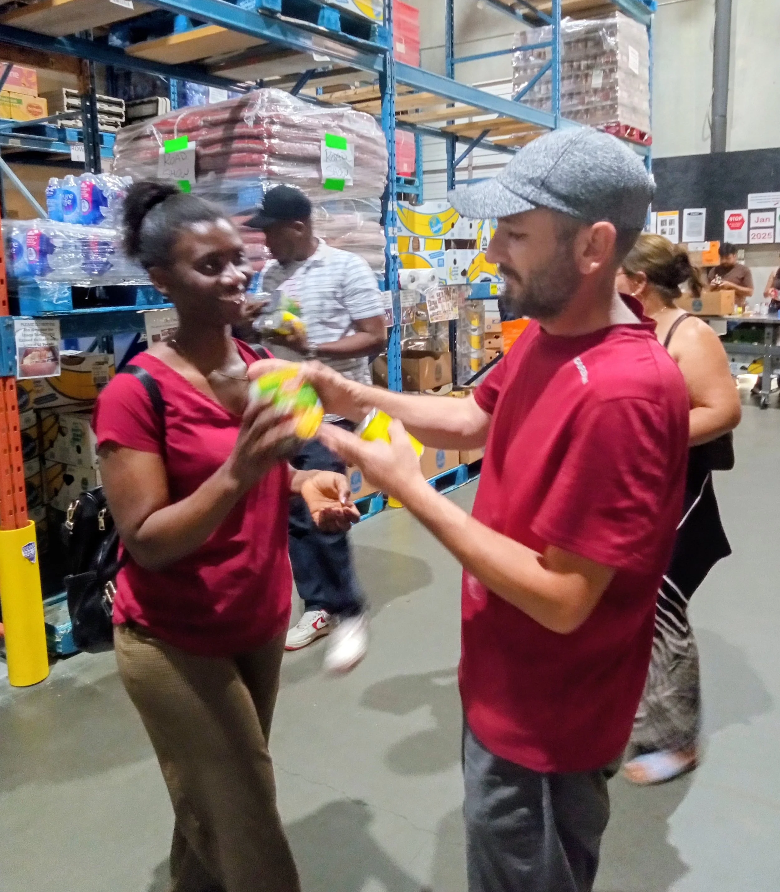 Orhan helping student Jane at the Food Bank.