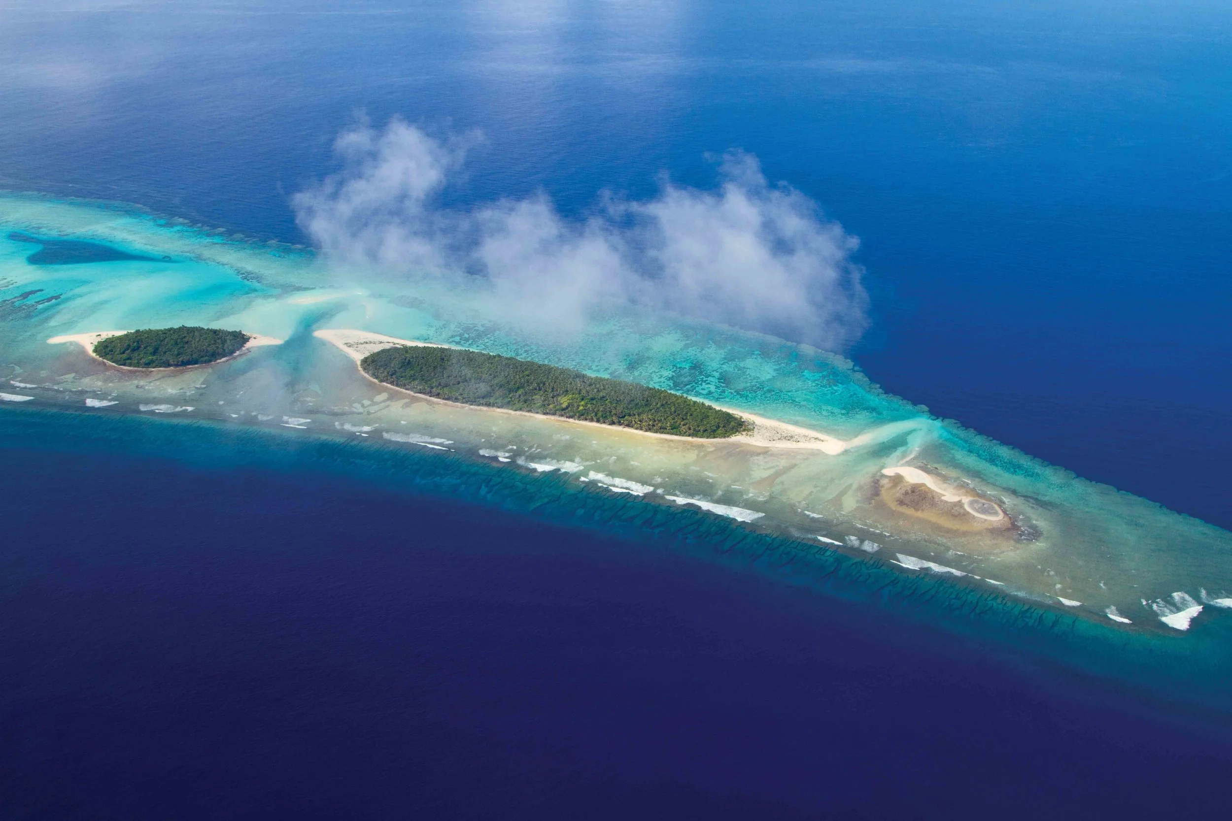 An aerial view of the Crab Islands near Falalop Island in Ulithi Atoll, Federated States of Micronesia, is shown. © Wayne Sentman
